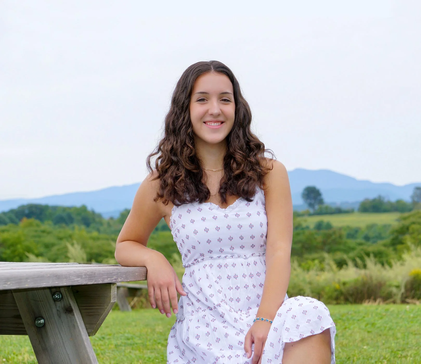 High school student portrait seated outdoors