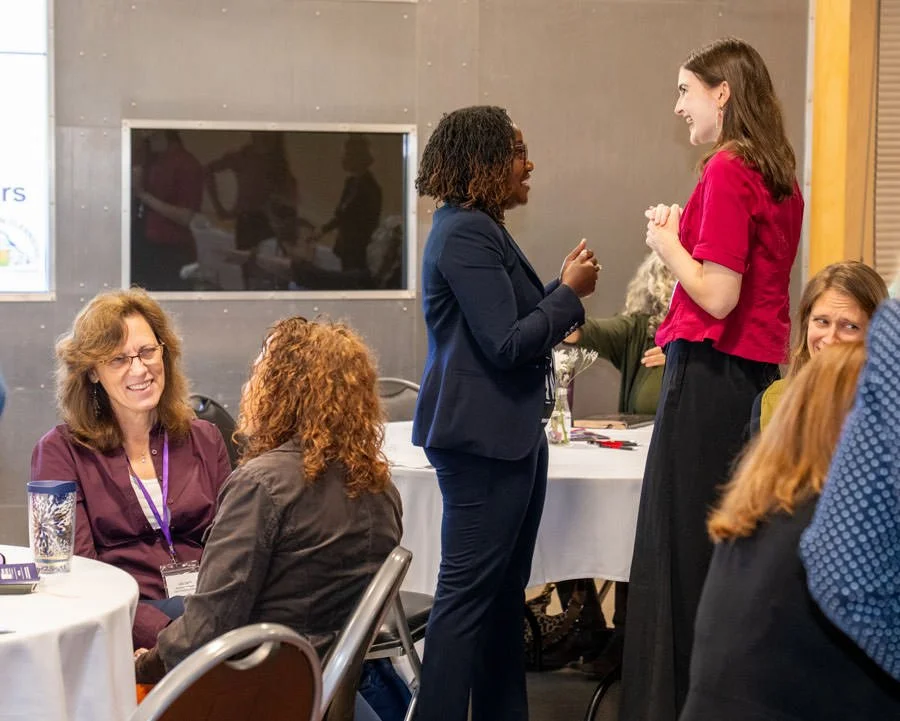 conference attendees meeting up and chatting