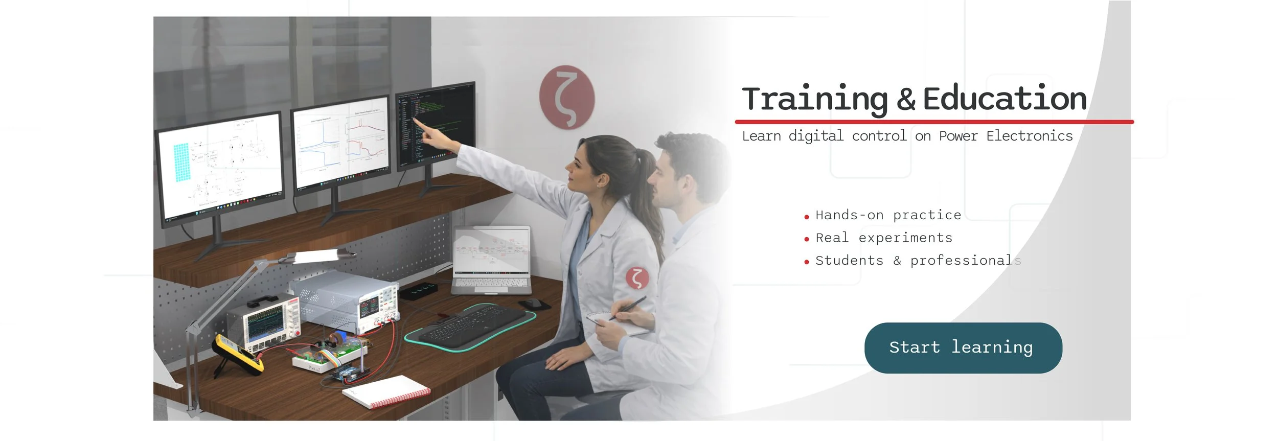 Two students in lab coats working on digital control training with multiple monitors displaying graphs and code, surrounded by electronic equipment, in a training room setting.