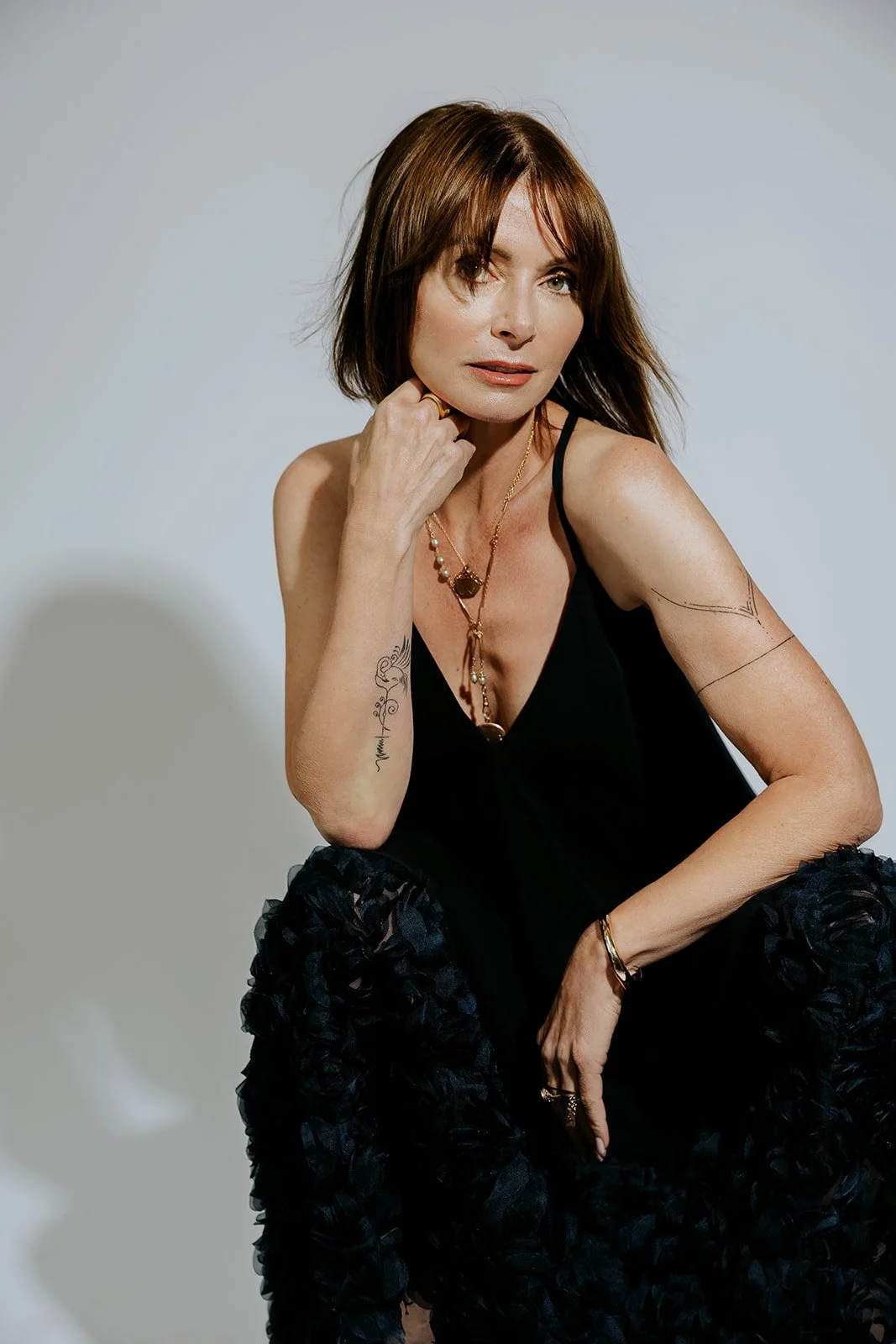 commercial photography and portrait of a woman jewelry artist in a branding photo
Branding headshot of a female jewelry designer in studio light
Professional portrait of Rhode Island jewelry artist wearing her jewelry