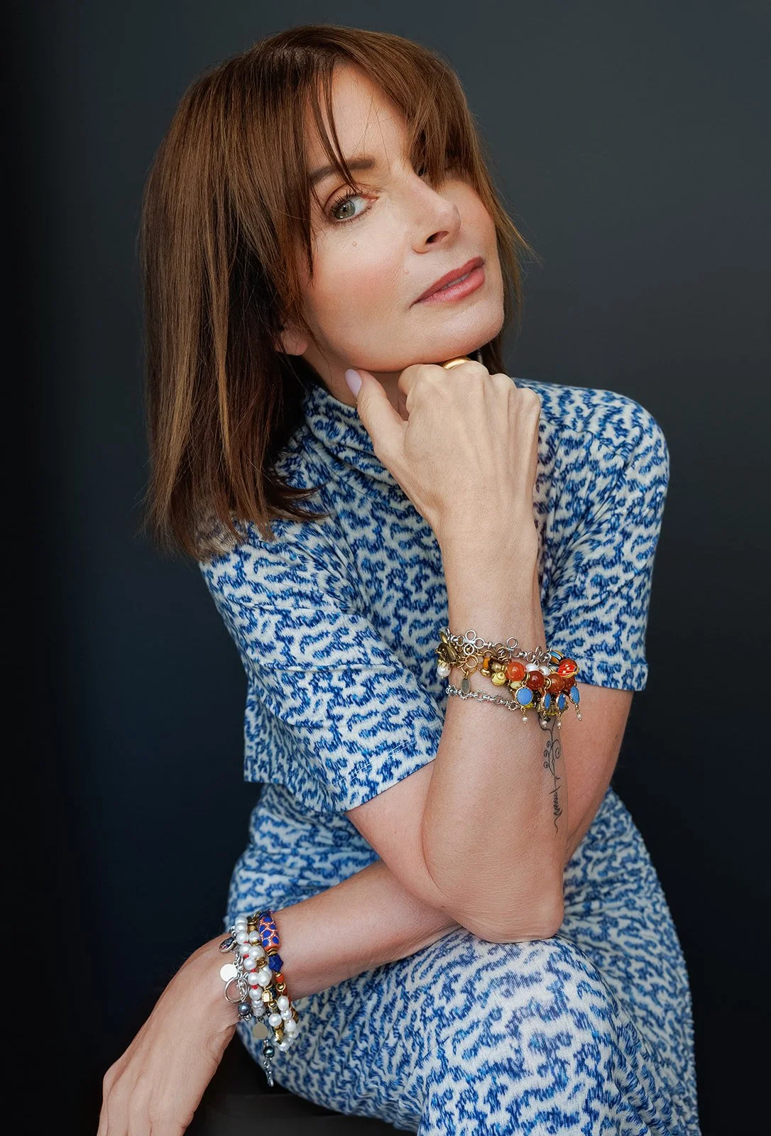 commercial photography and portrait of a woman jewelry artist in a branding photo
Branding headshot of a female jewelry designer in studio light
Professional portrait of Rhode Island jewelry artist