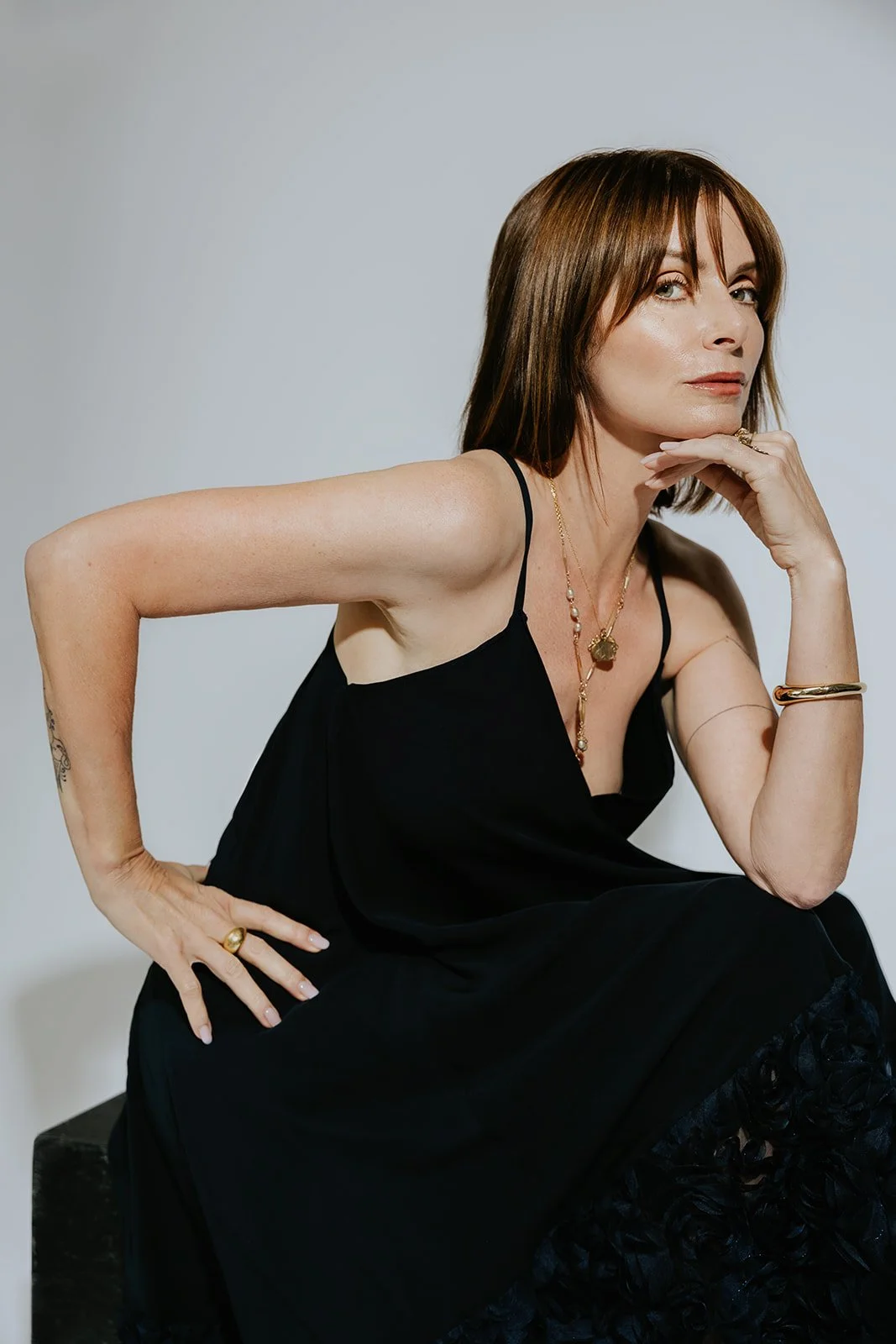 commercial photography and portrait of a woman jewelry artist in a branding photo
Branding headshot of a female jewelry designer in studio light
Professional portrait of Rhode Island jewelry artist wearing necklace