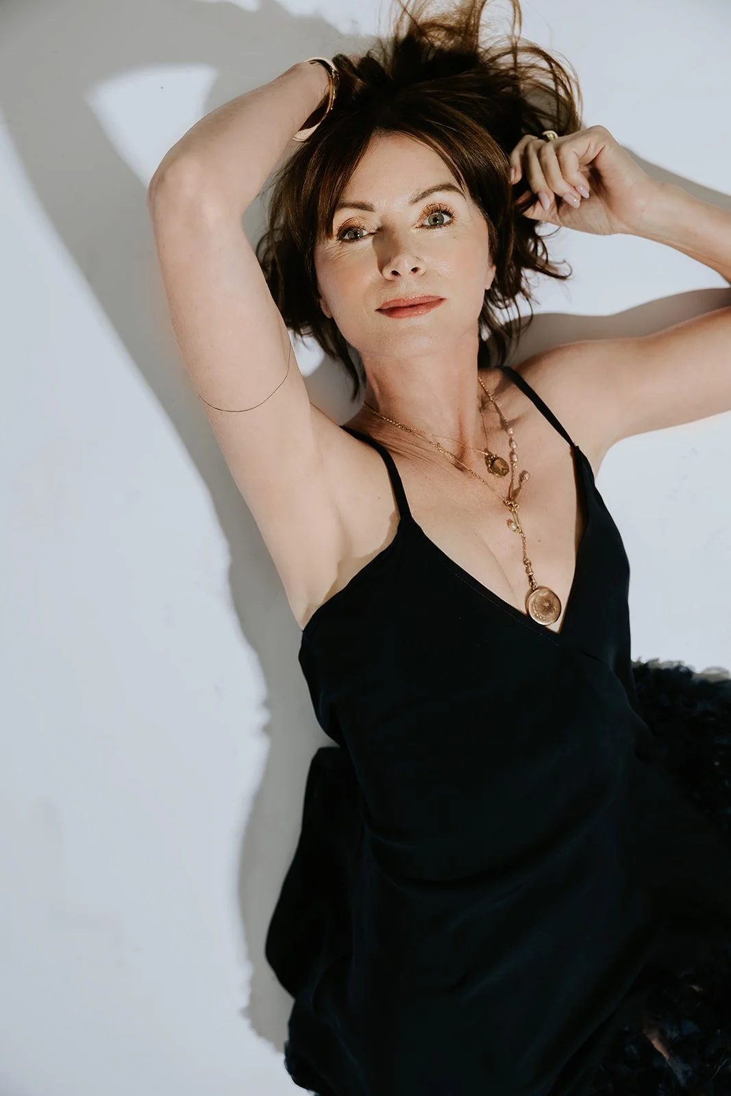 commercial photography and portrait of a woman jewelry artist in a branding photo
Branding headshot of a female jewelry designer in studio light
Professional portrait of Rhode Island jewelry artist