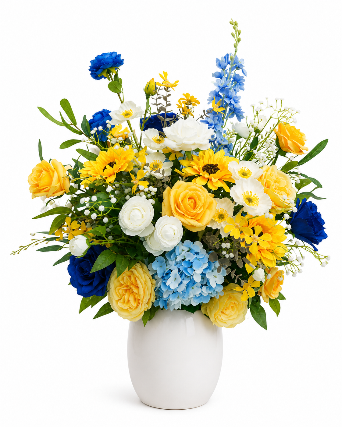 Artificial floral arrangement with yellow roses, blue hydrangeas, white flowers, and blue accent blooms in a white ceramic vase on a white background.