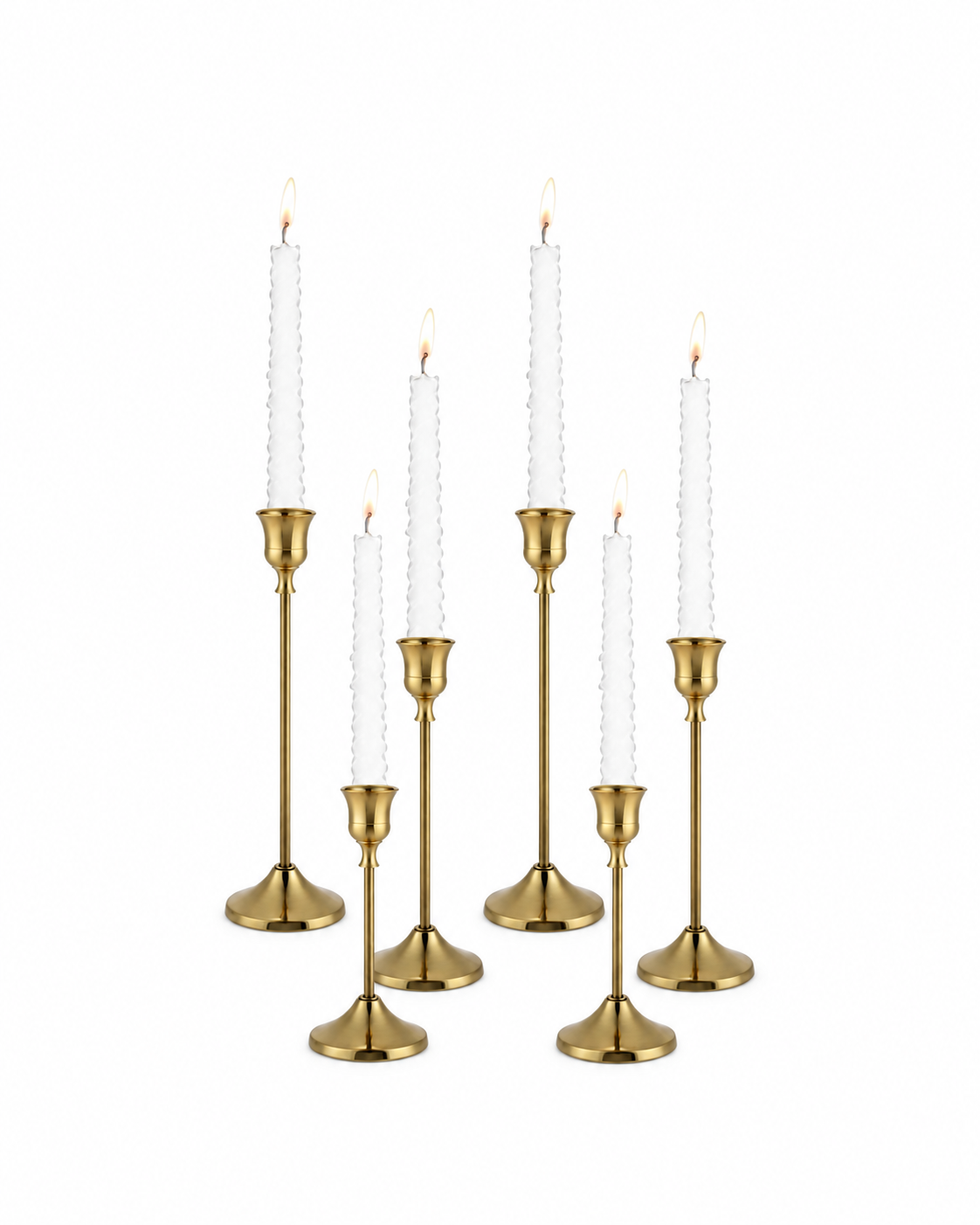 six gold candlestick holders of varying heights with lit ivory taper candles on a white background