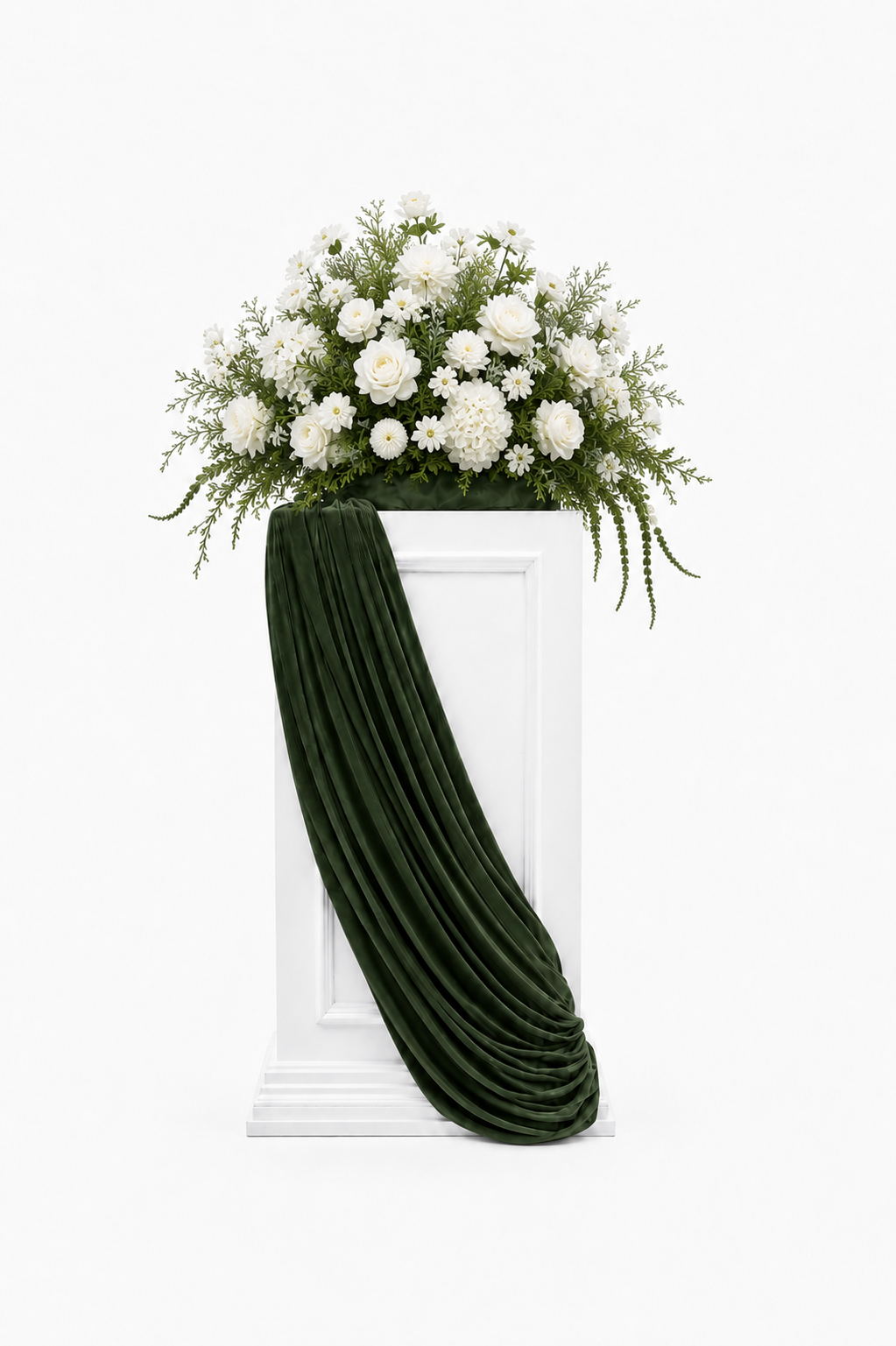 White and greenery floral arrangement displayed on a white pedestal with dark-green draping.