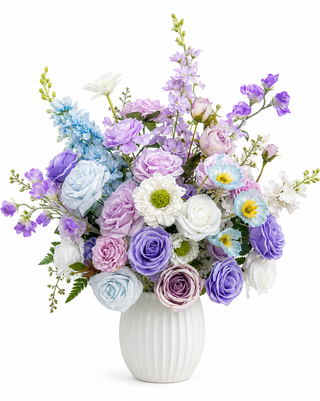 Artificial floral arrangement with lavender, pale blue, and white flowers in a white ceramic vase on a white background.