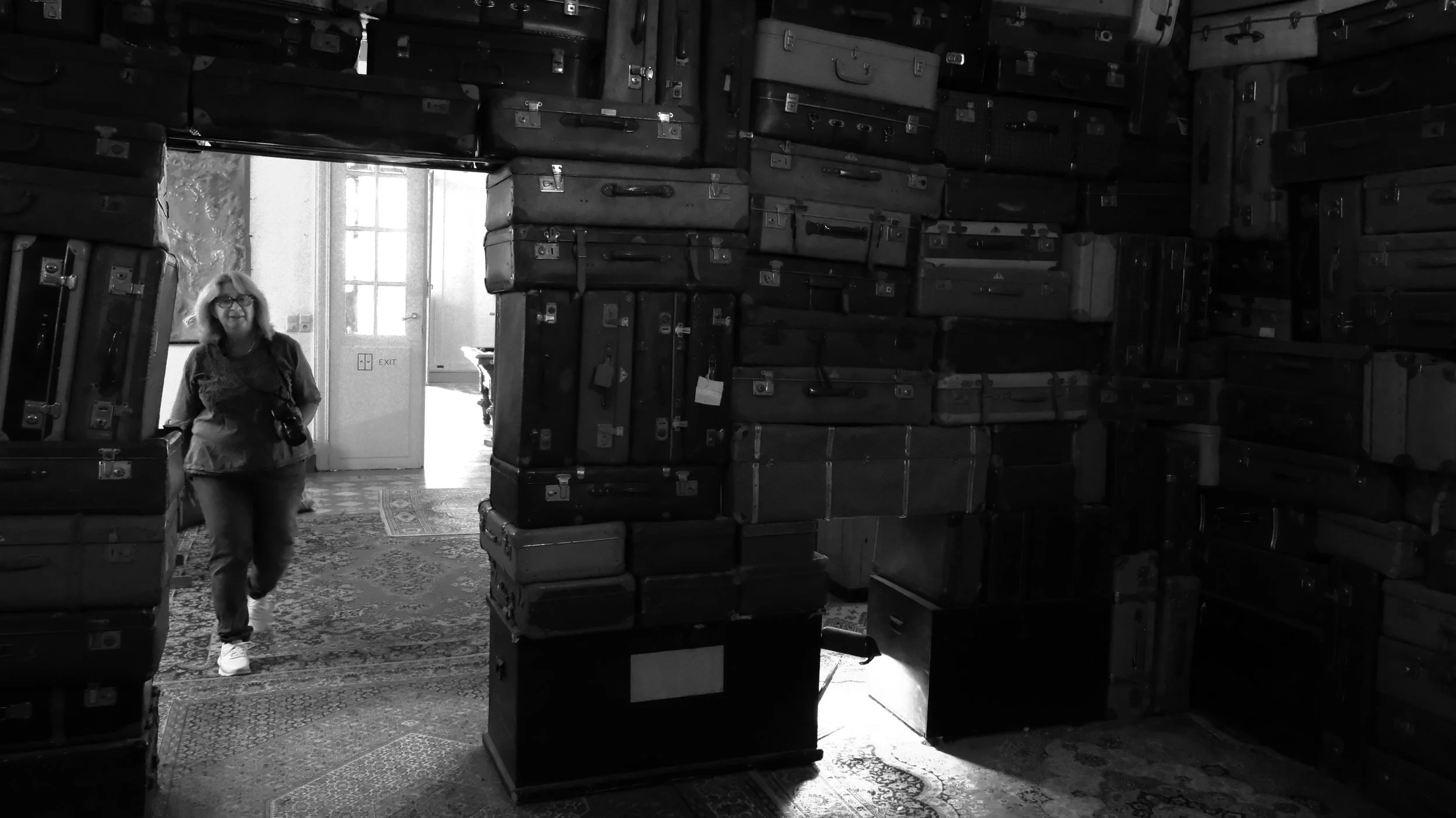 Walking through a Large Stack of Suitcases - Ghent
