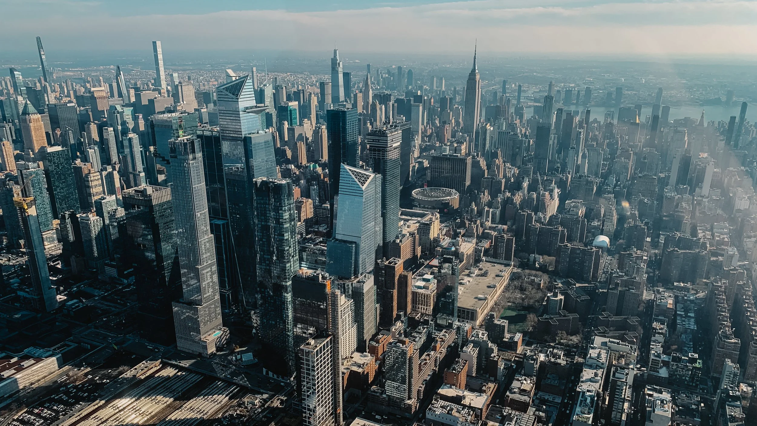 Aerial view of Manhattan skyline with skyscrapers and urban landscape, New York City.