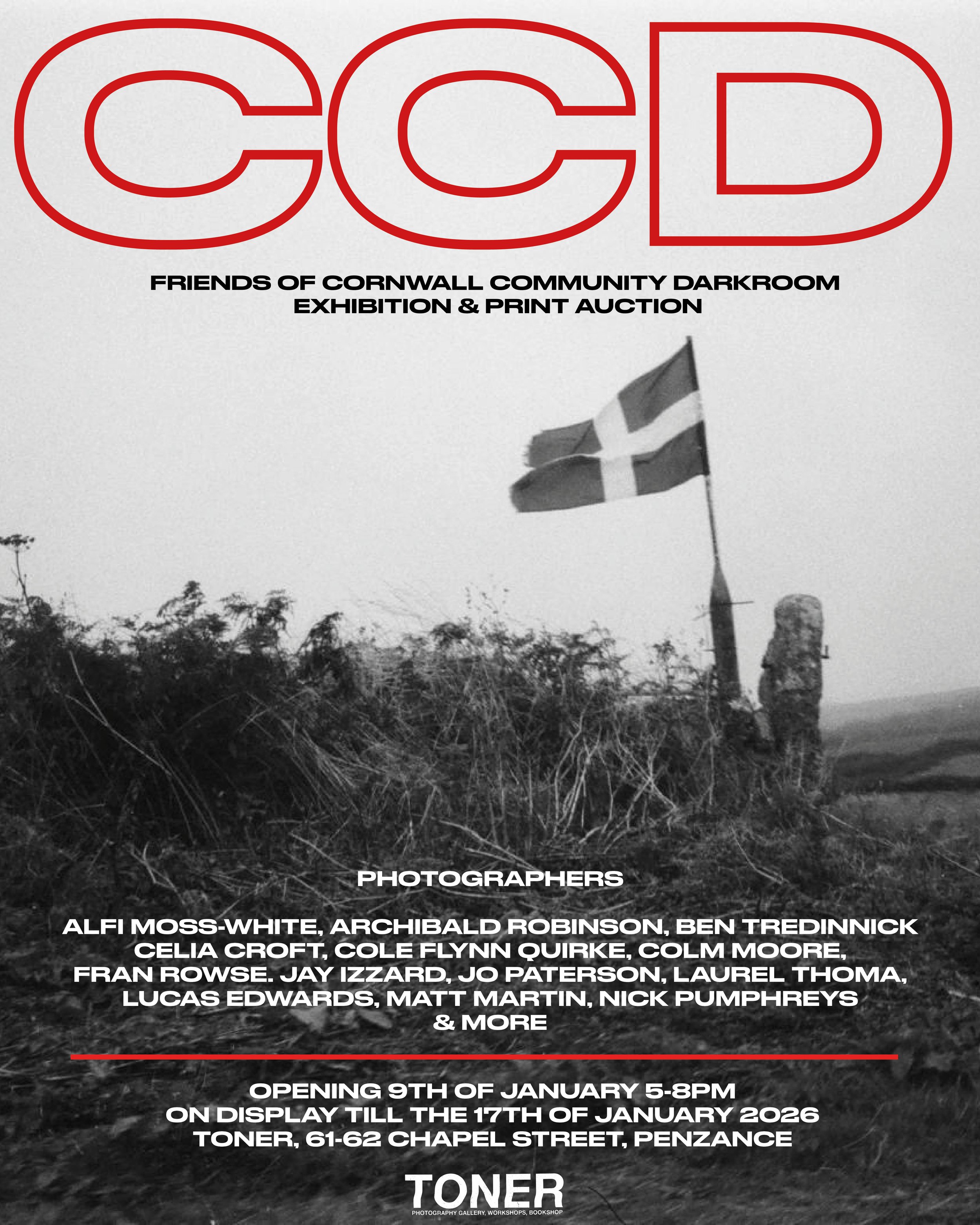 Black and white poster for an exhibition titled 'Friends of Cornwall Community Darkroom' featuring a photograph of a flag on a pole in a natural landscape with bushes and moorland. The poster lists photographers' names and event details, including the opening date, hours, and location at Toner, Penzance.