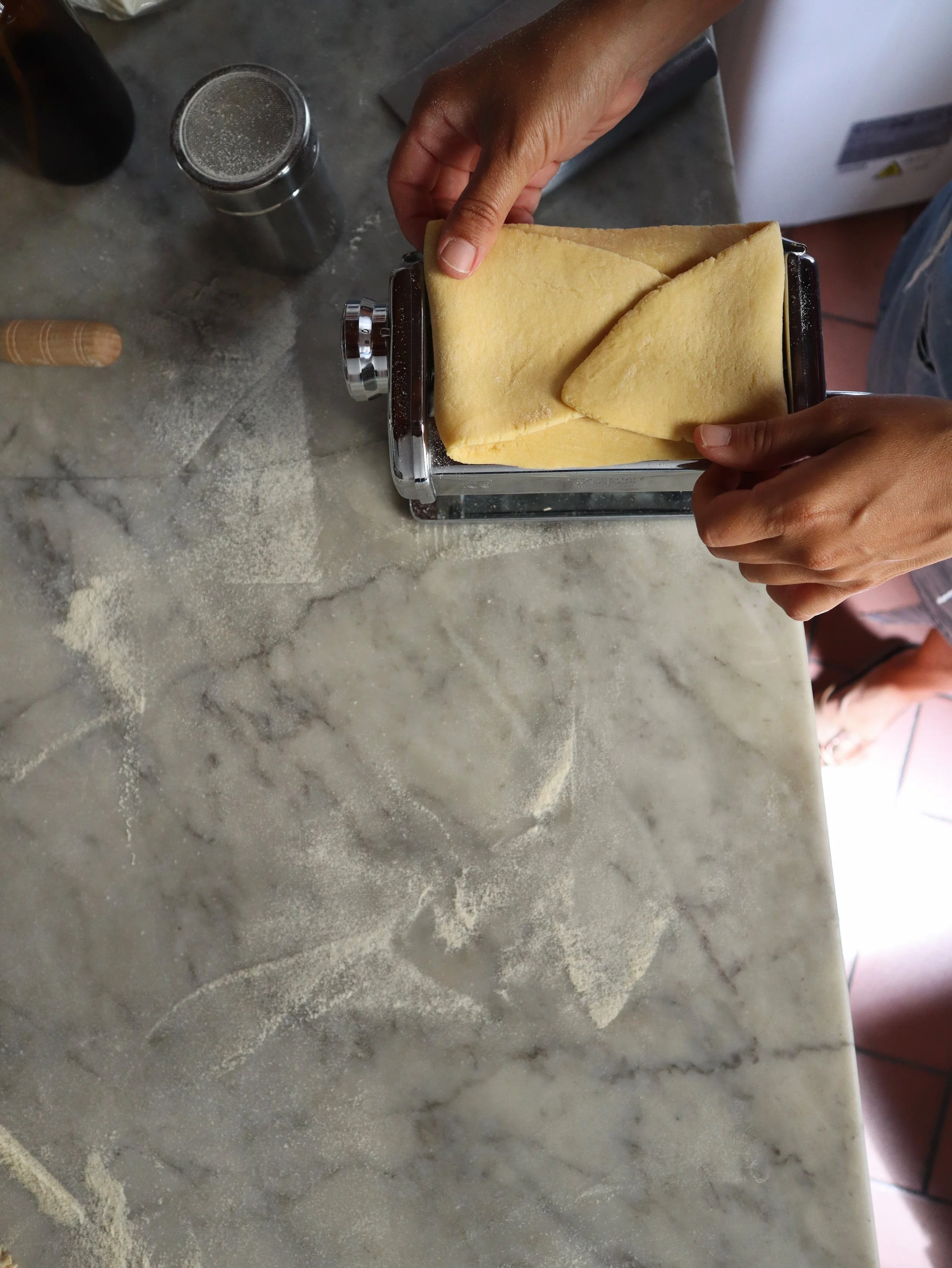 Fold the dough in thirds and run it through the machine on 0