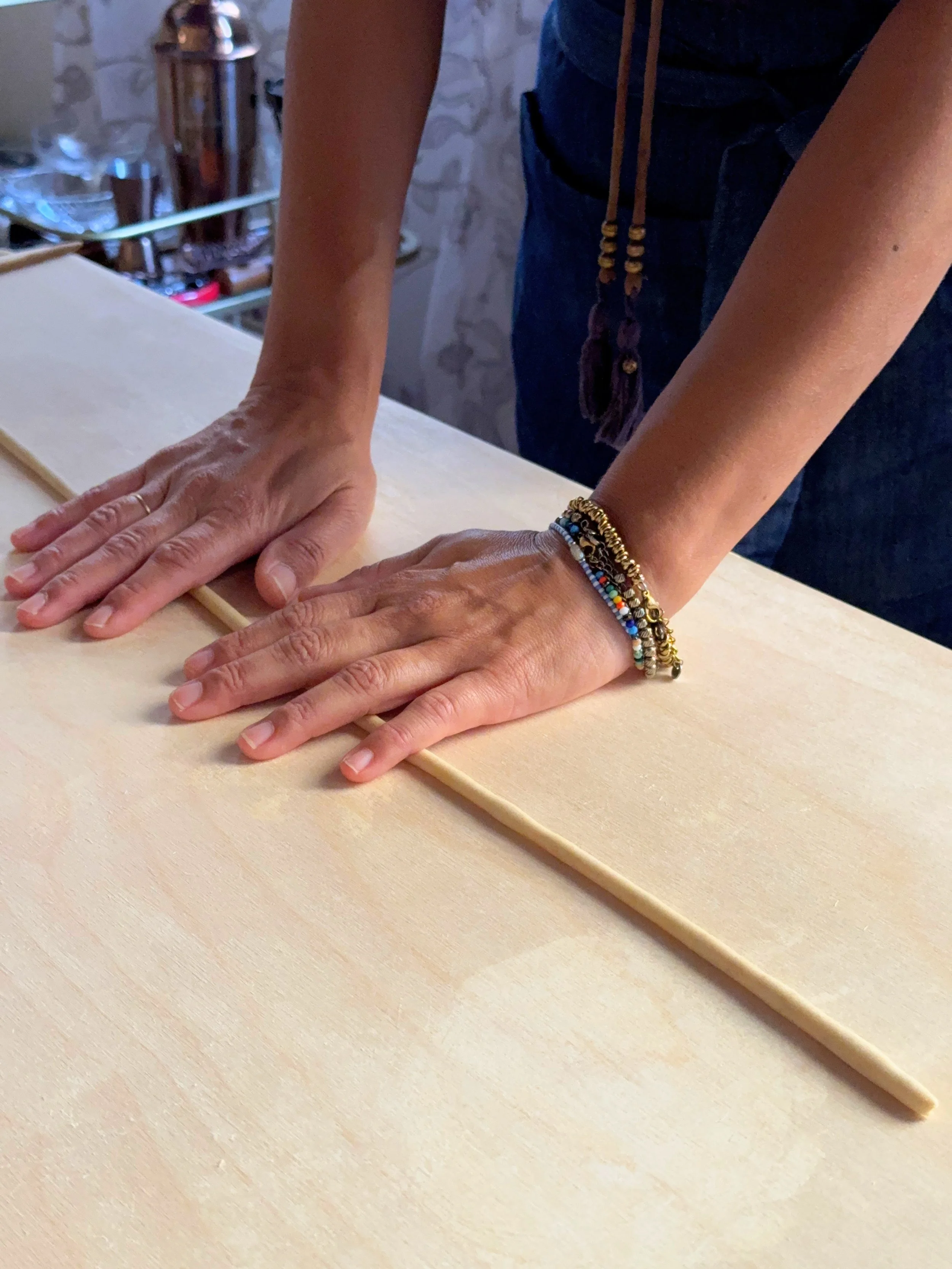 using slight pressure to roll out the strip