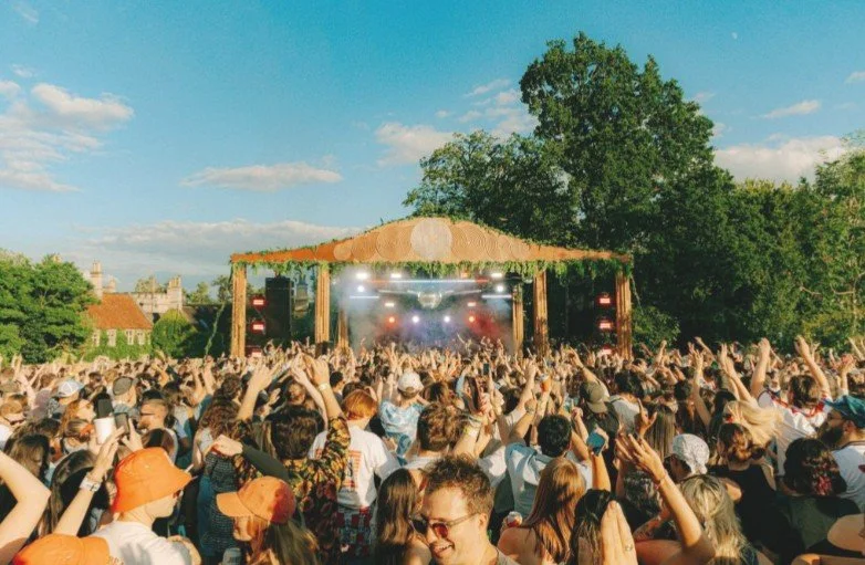 Open-air concert crowd at Tofte Manor near The Grove at Melchbourne