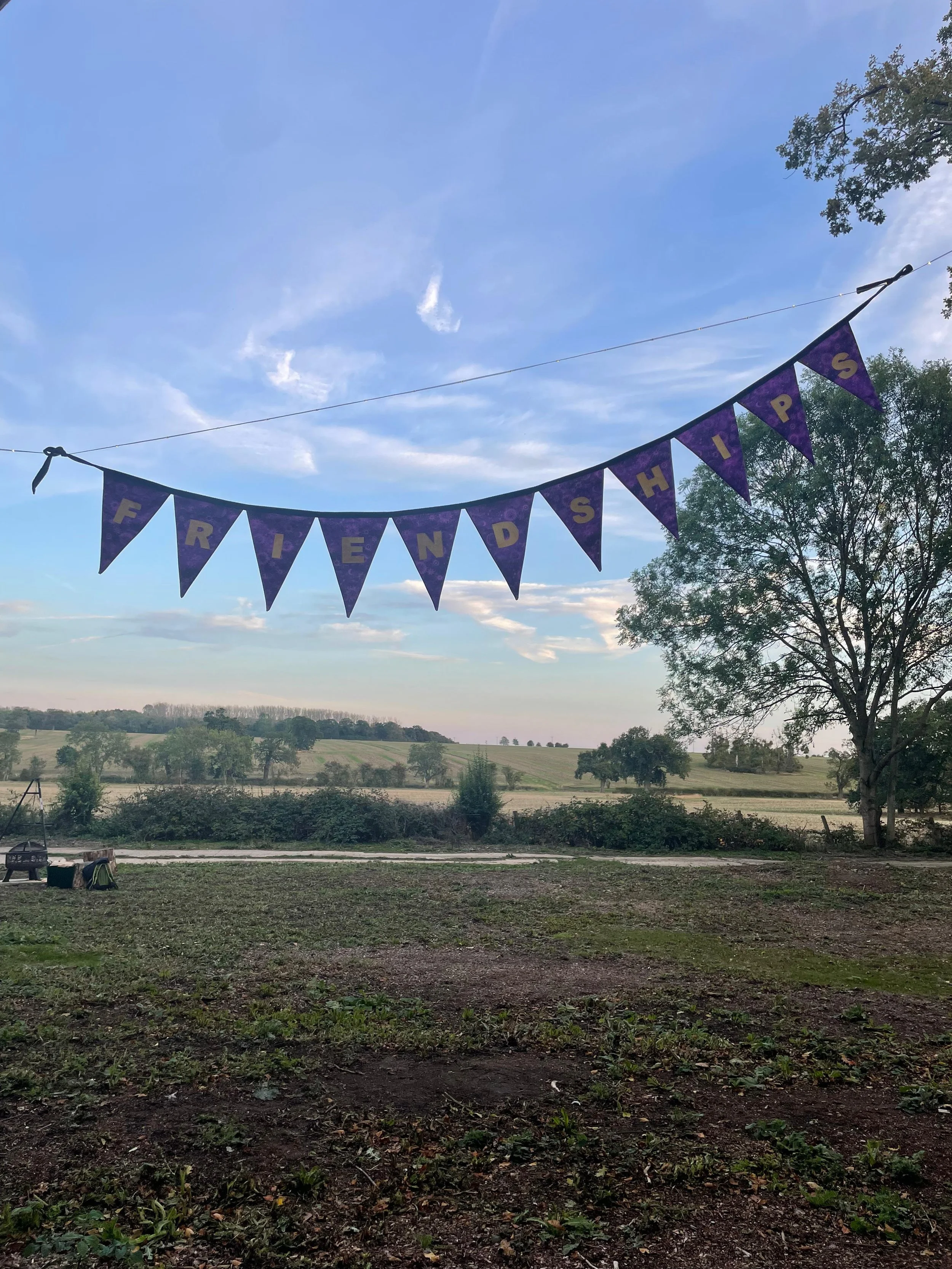 Friends banner above the campsite for a private gathering at The Grove