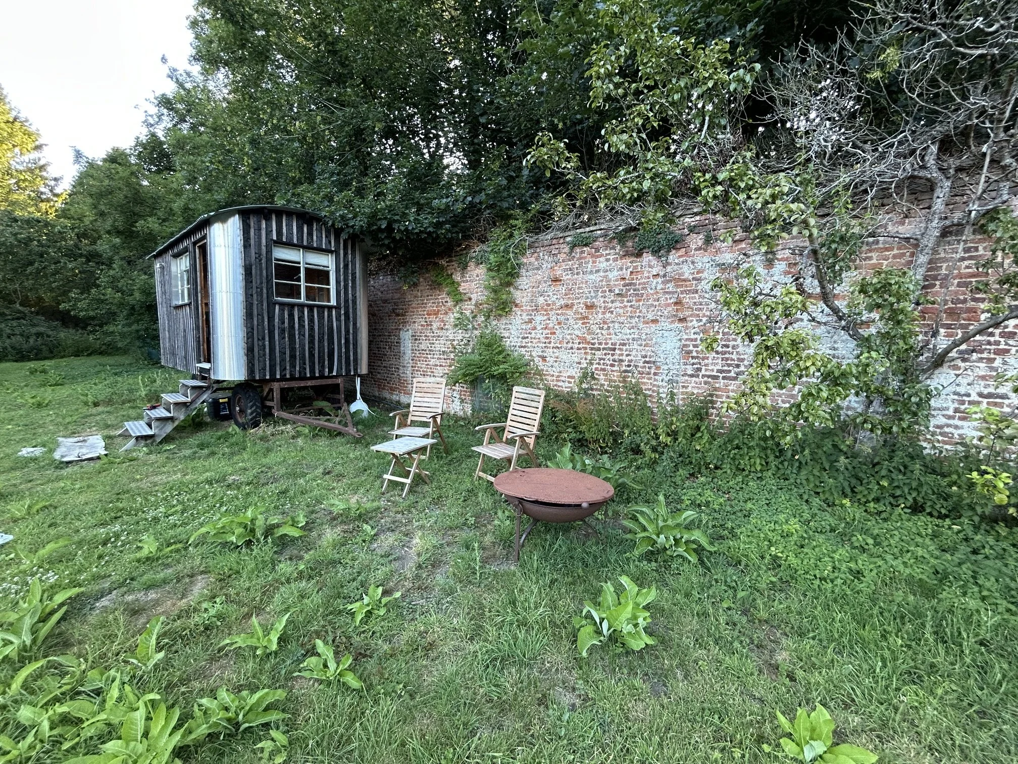 Shepherd's wagon in walled garden