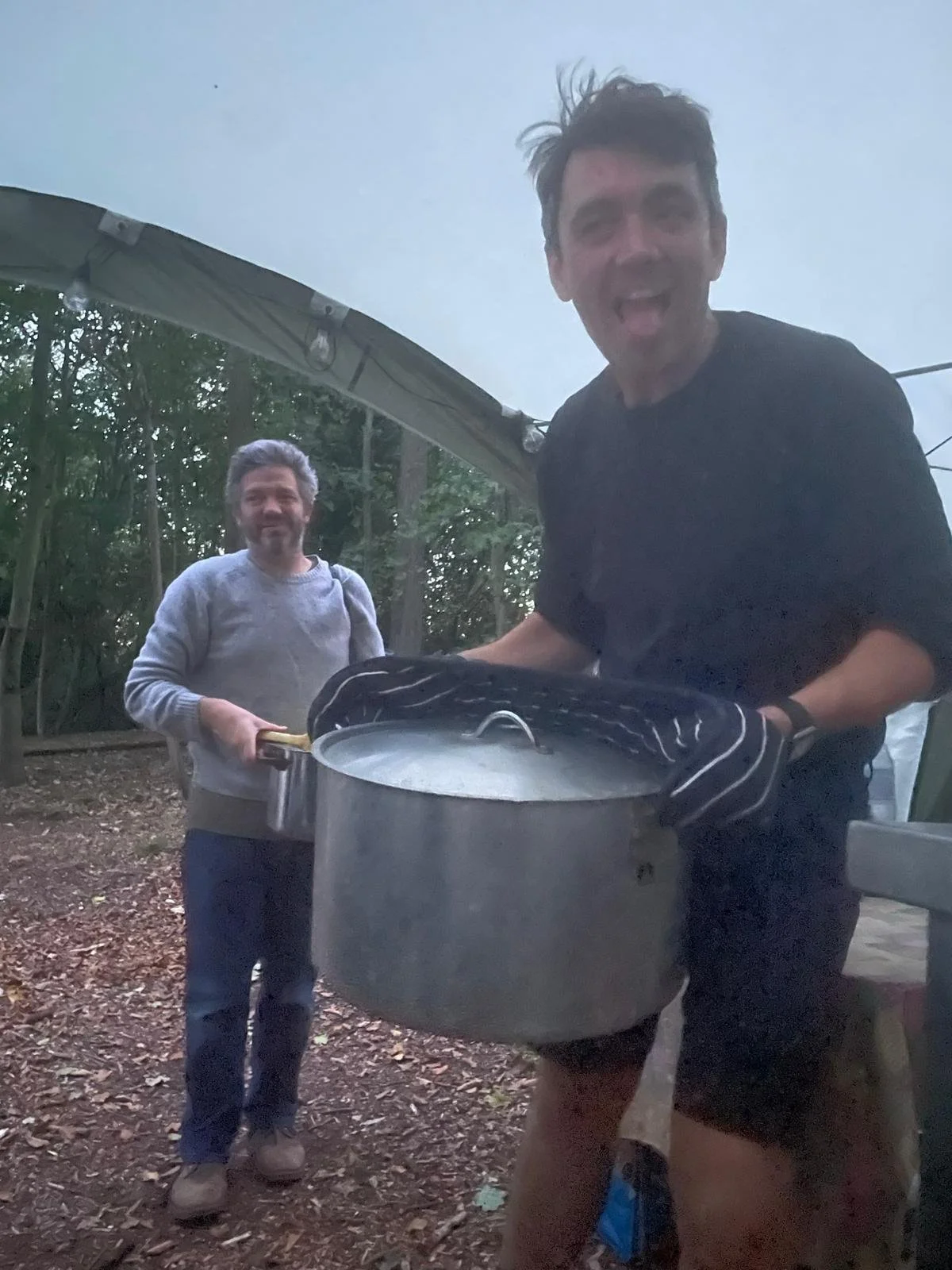 Guests cooking together in the field kitchen at The Grove