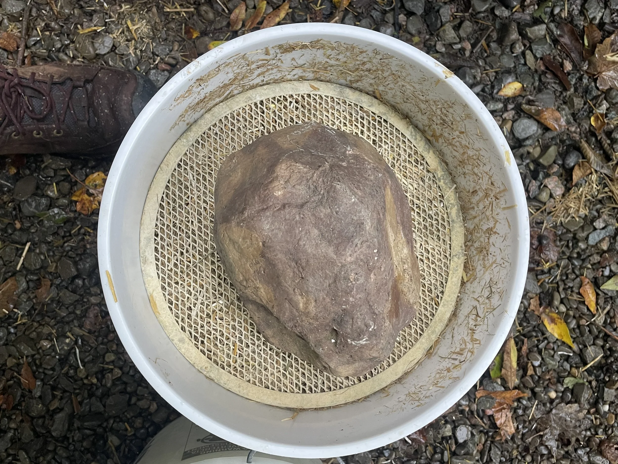 weight down the straw with a rock or brick, and a screen helps too!