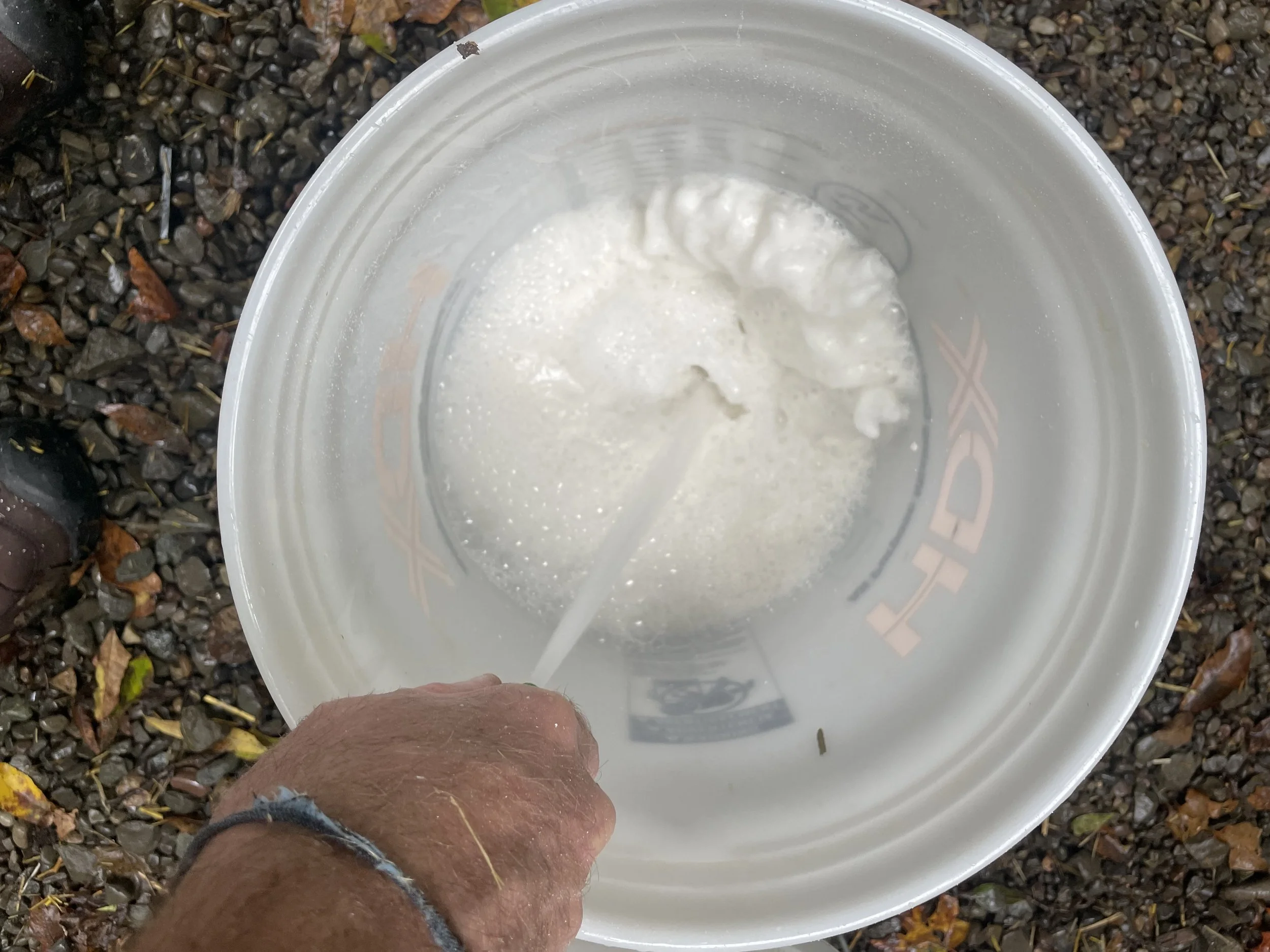 add lime carefully so it doesn't plume up when you spray water