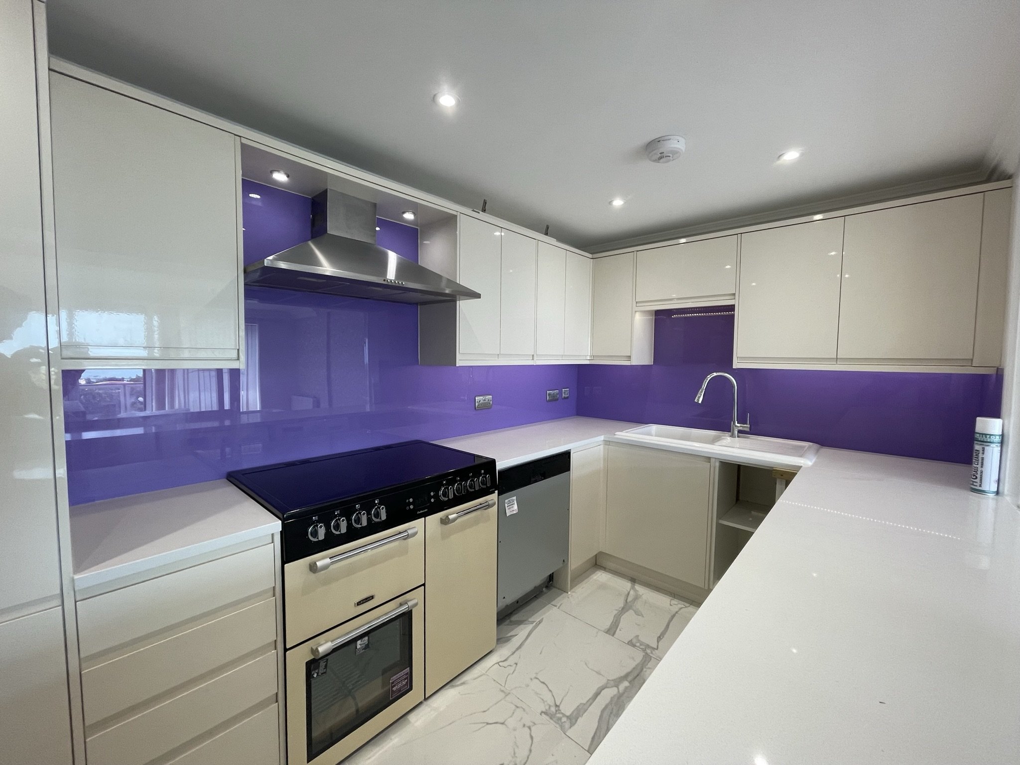 purple glass splashback installation UK kitchen.JPEG