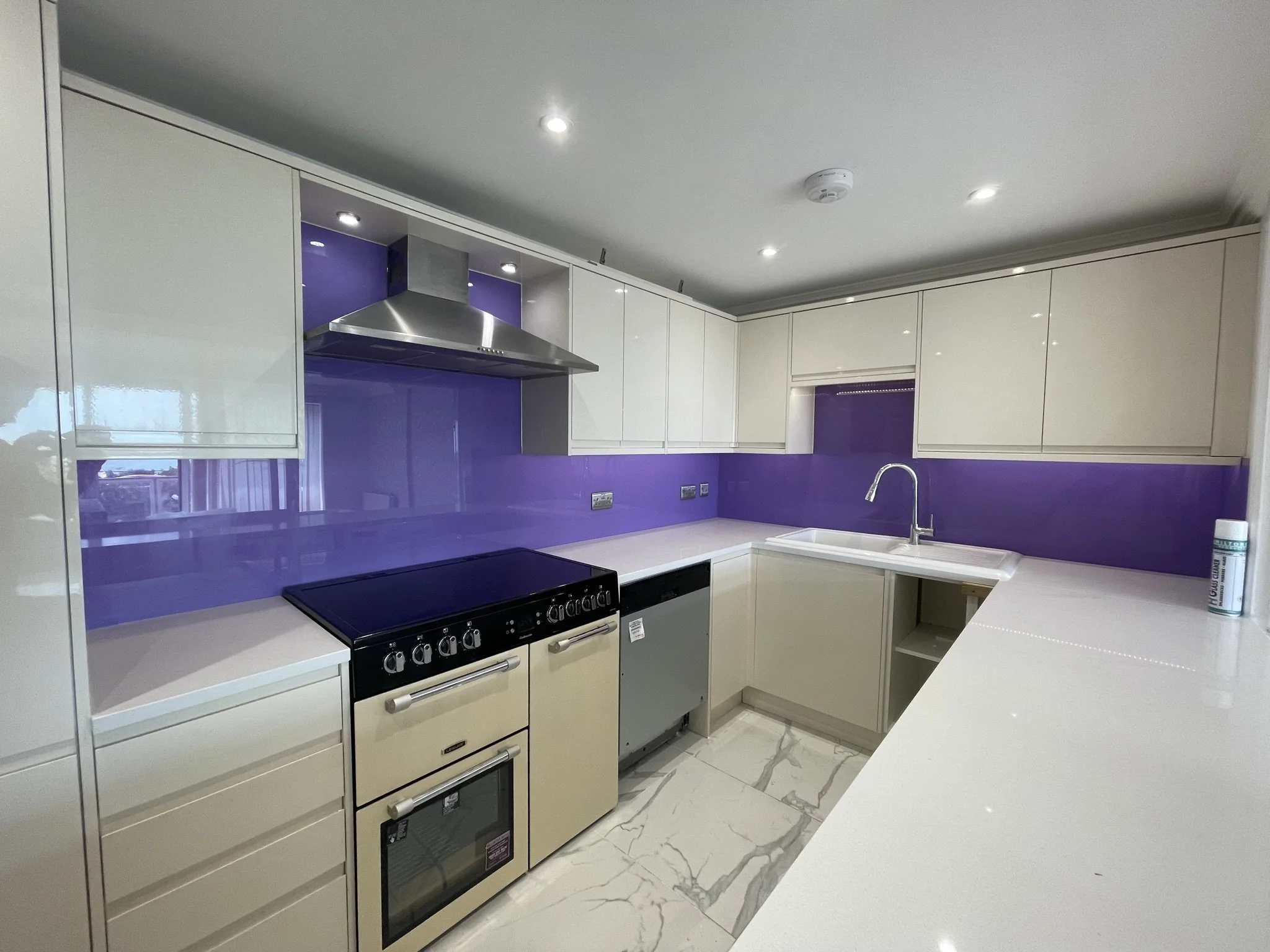 purple glass splashback installation UK kitchen.JPEG