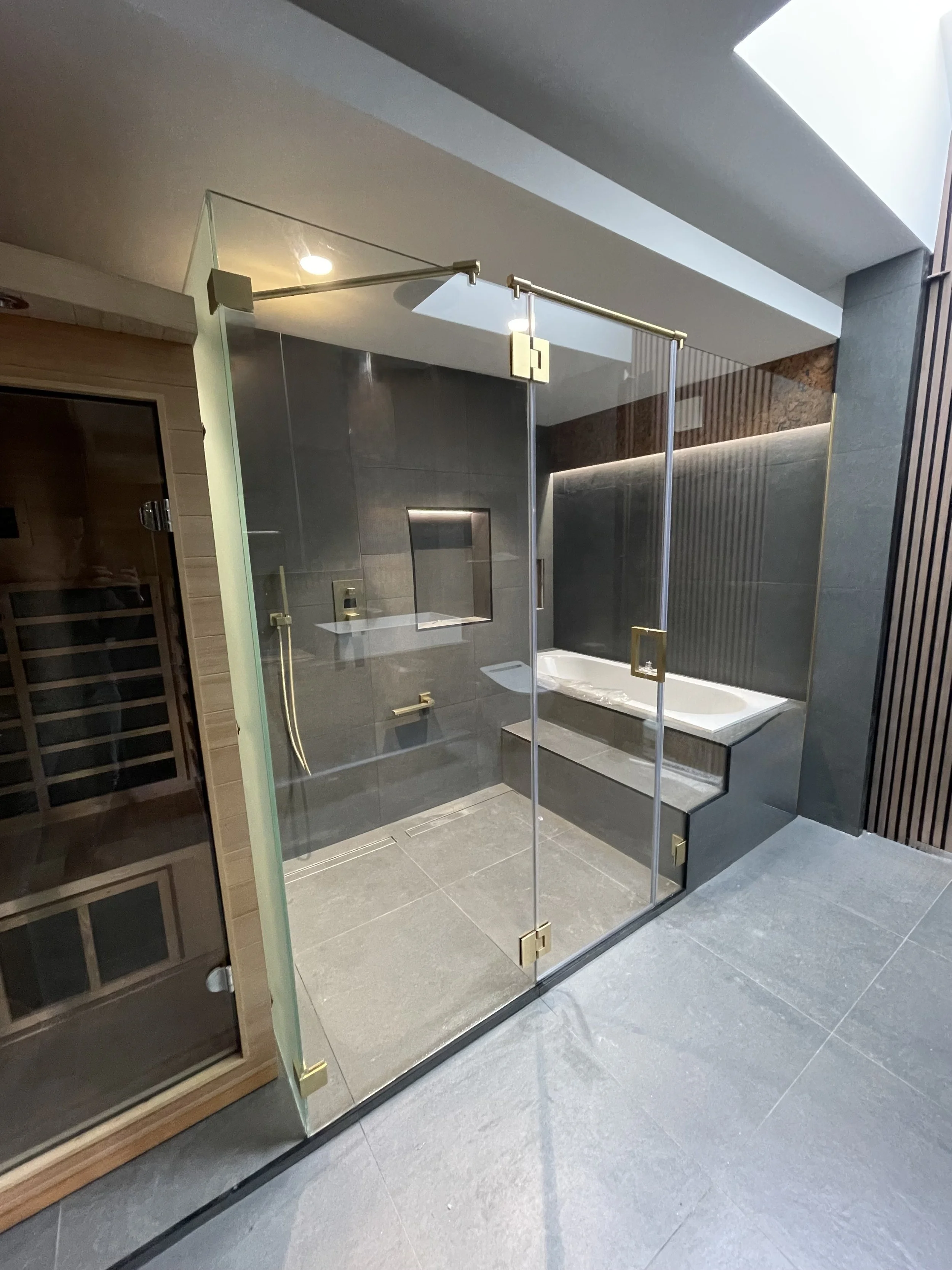 Toughened glass partition screens cut to size with polished edges and specialist hardware fixings