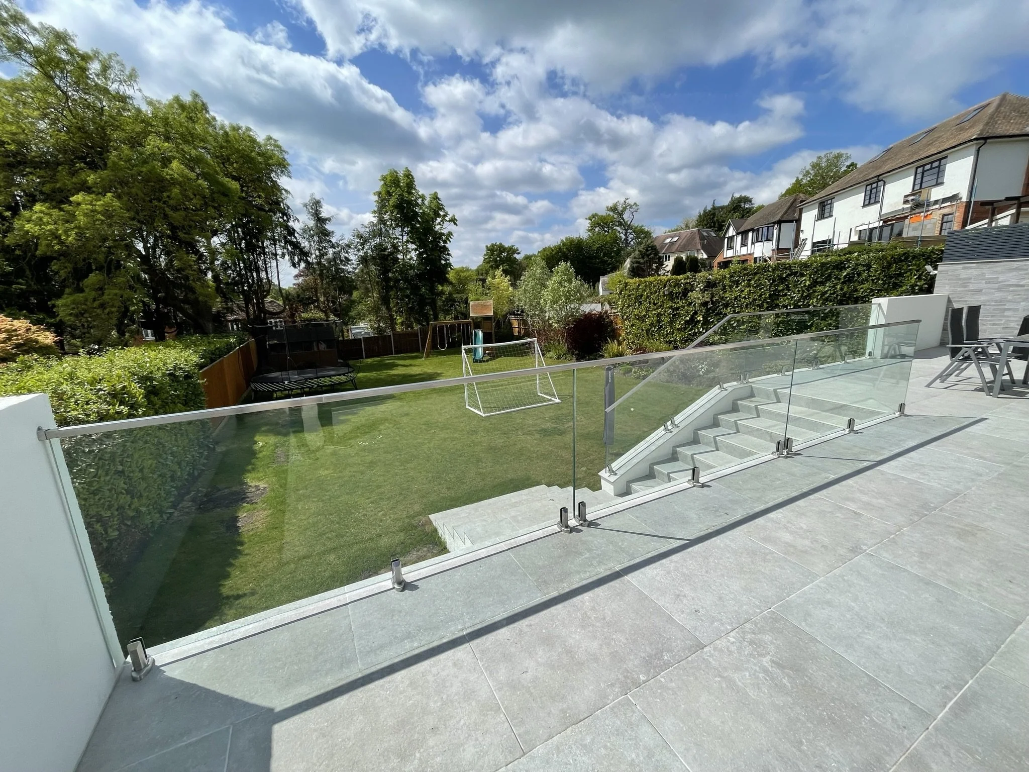 External glass balustrade overlooking the River Thames in Walton, providing safety and unobstructed views of the water.