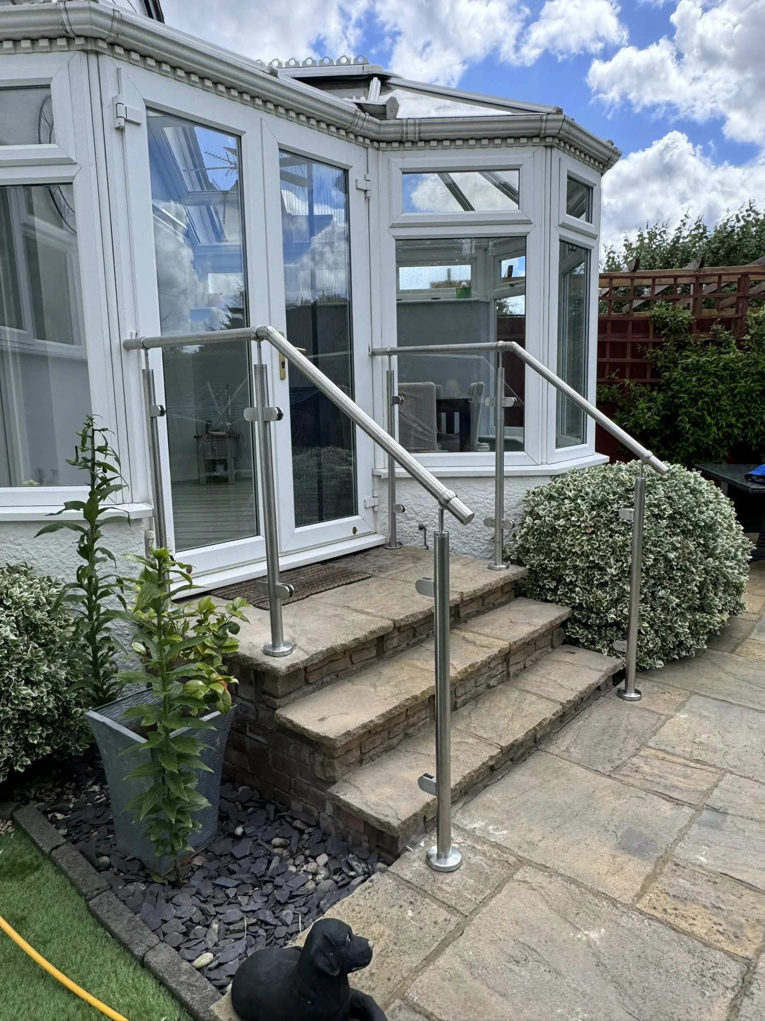 Frameless structural balustrade formed from toughened laminated glass panels with concealed structural fixings