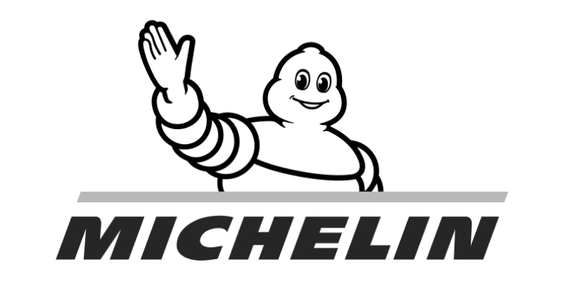 A cartoon character with a big smile, waving, with the word 'Michelin' underneath.