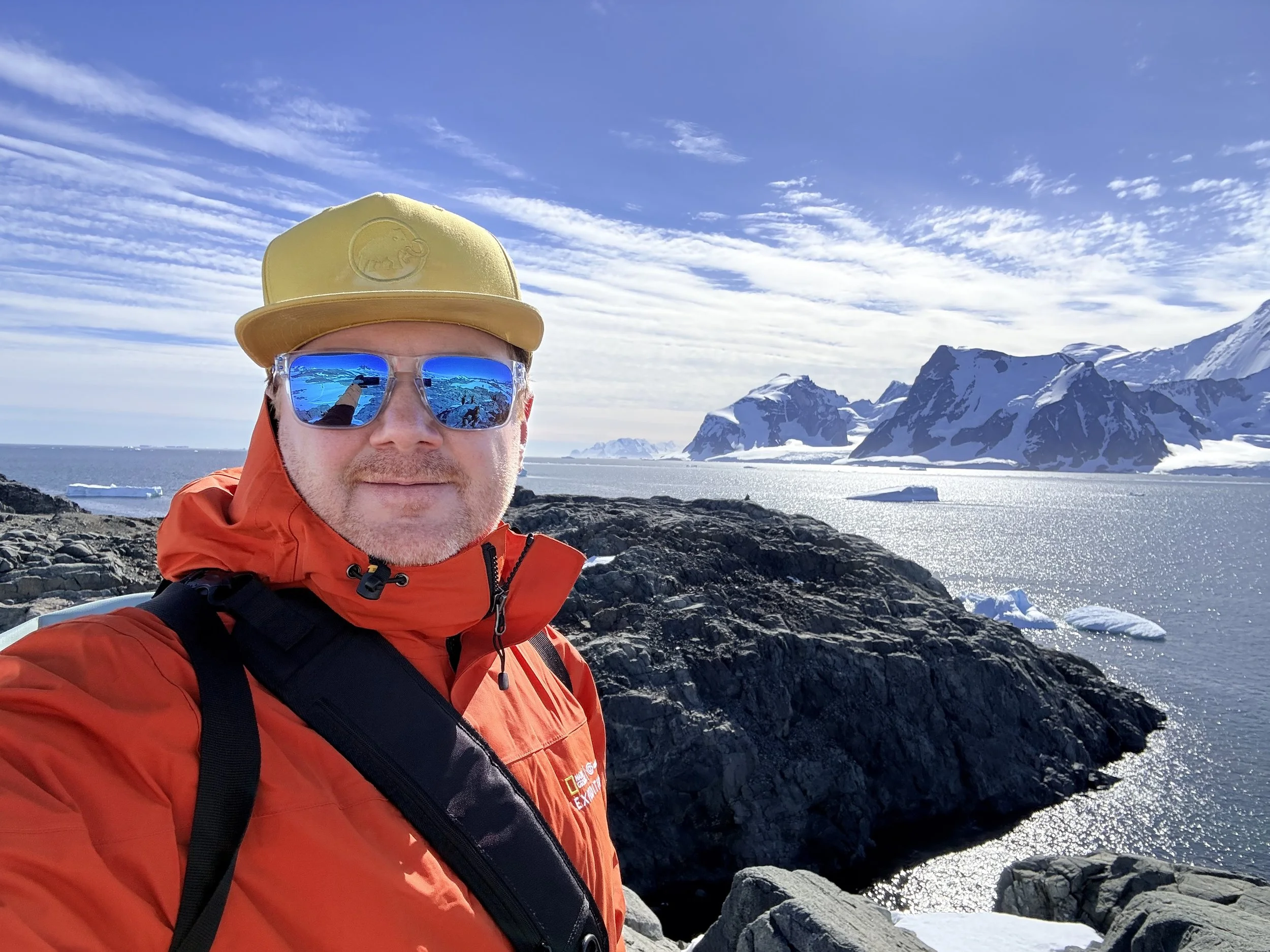 Court Rustemeyer on an Arctic expedition, overlooking icebergs and mountains
