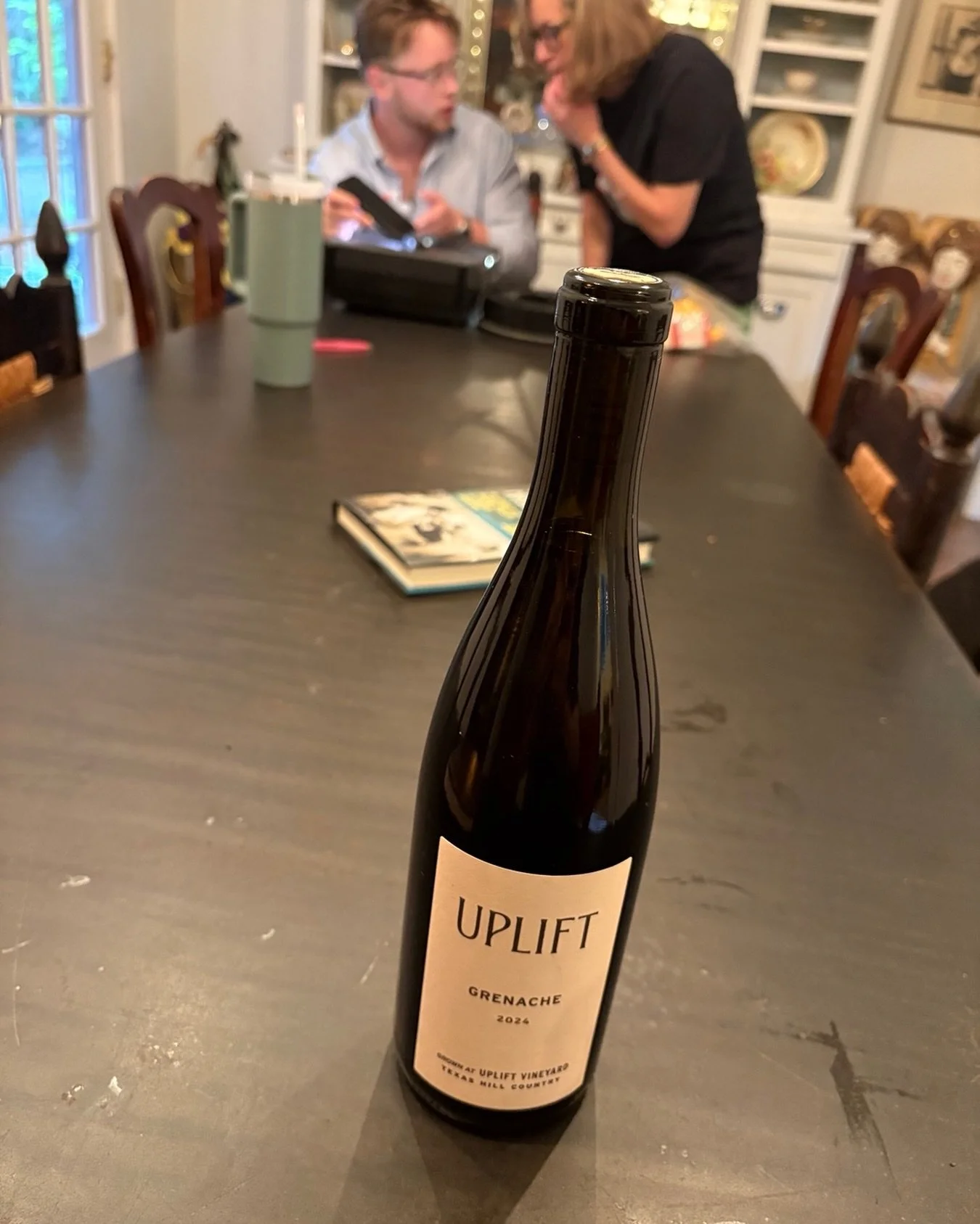 Memorial Day Weekend tableau. In the background, @jess_edge and @hobbsblair work to rejuvenate the Hobbs family slide projector. In the foreground stands the bottle of Texas Grenache that @bluebonnetjoy and @bphilpott13 gifted us. Ribeyes from @lbsme