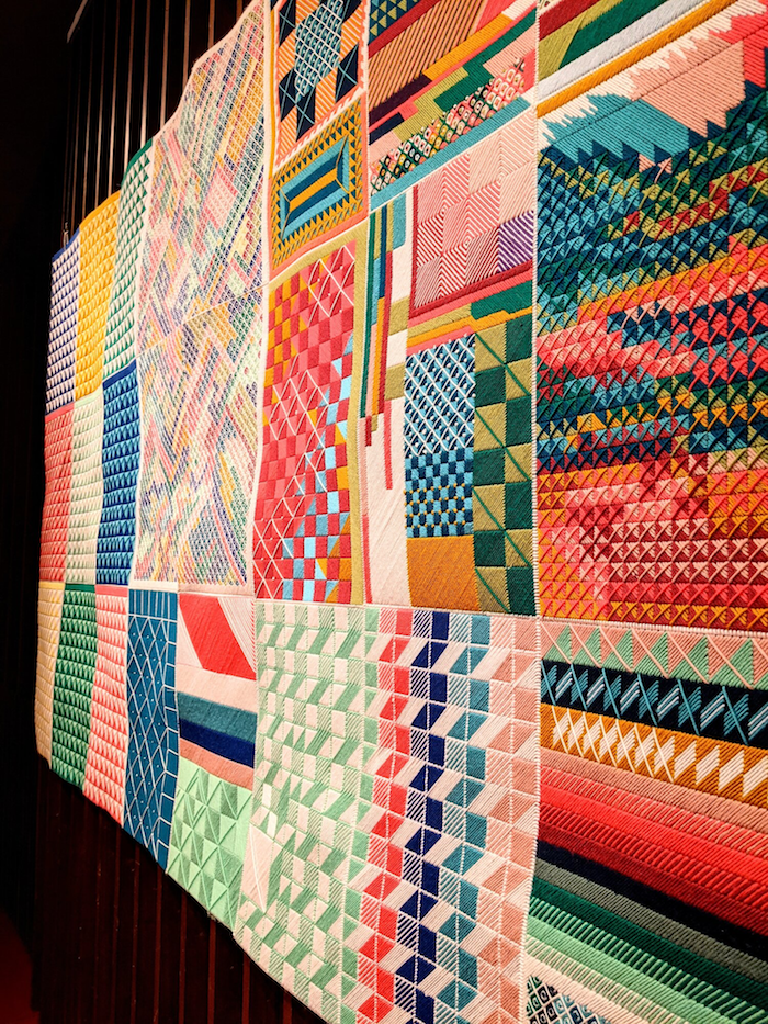 Side view of “In An Instant” Yarn on plastic canvas. 66” x 120”