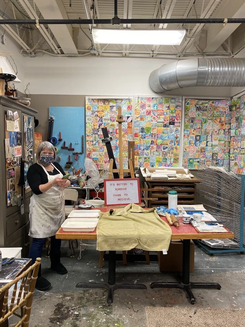 Andrews in her studio, creating prints for Forgiving Tuesday.