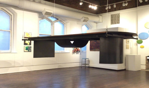 Osborn designed and crafted the Harrison Gallery's descending table.