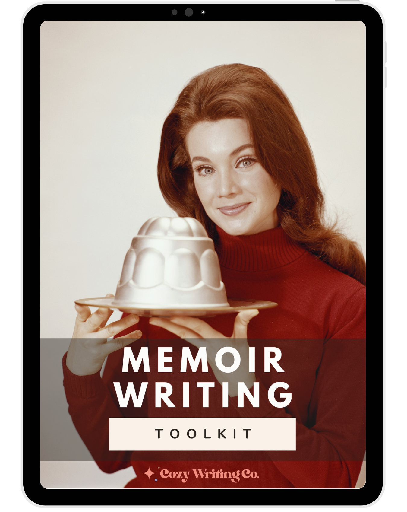 iPad displaying the Cozy Writing Co. Memoir Writing Toolkit cover featuring a woman in a red turtleneck holding a molded gelatin dessert.