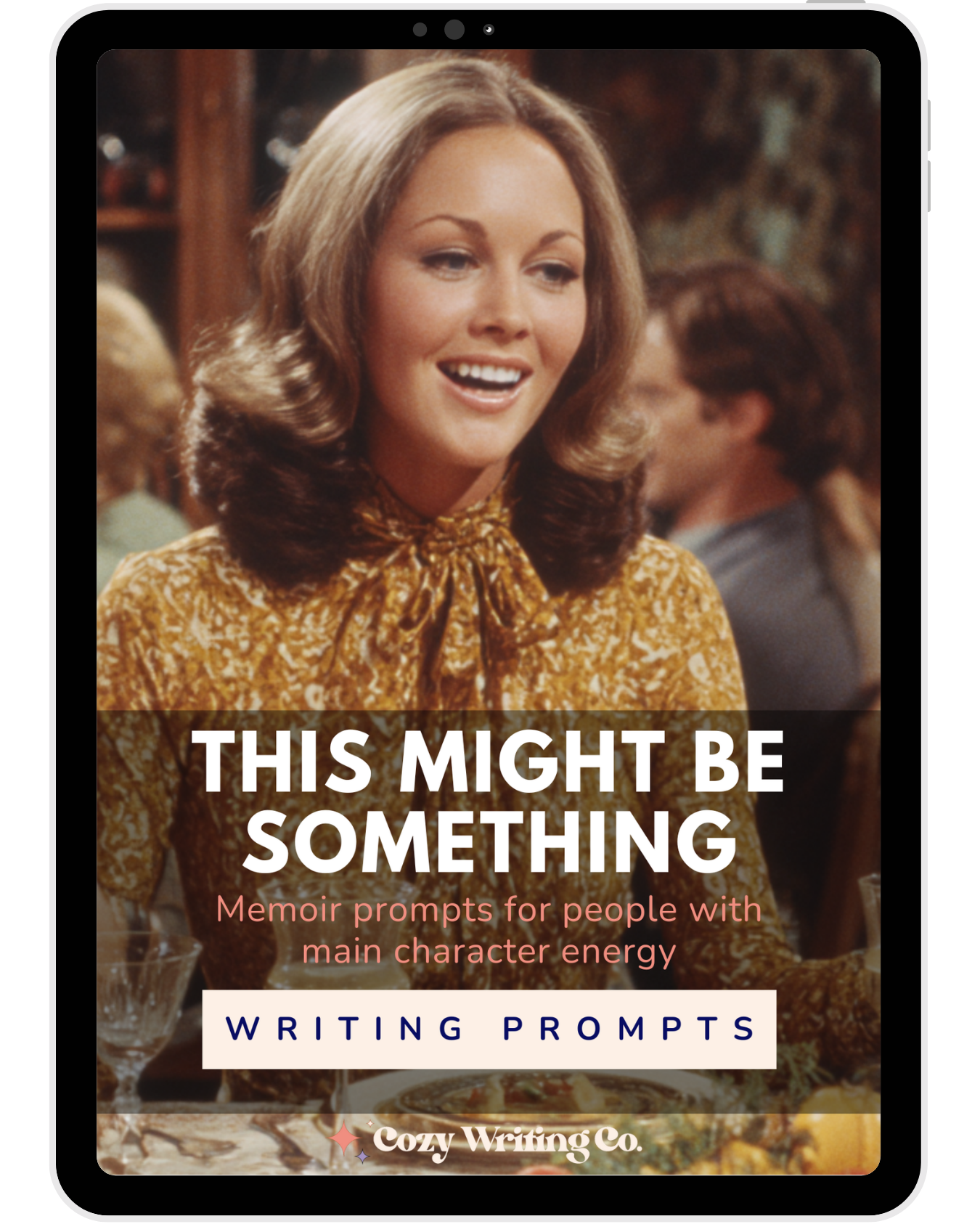 A 1970s woman in a floral shirt, smiling during a conversation, for the cover of This Might Be Something: Memoir Prompts for People With Main Character Energy. Writing Prompts product shown on an iPad
