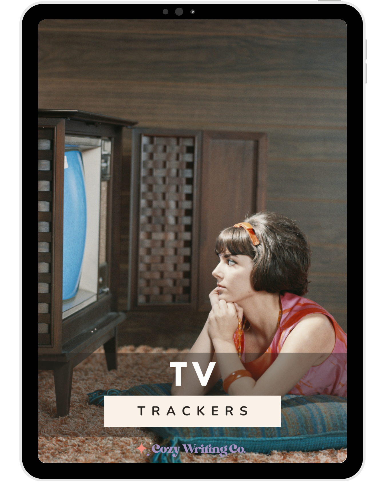 iPad displaying the TV Trackers cover featuring a woman watching an old television set while leaning on her hands.