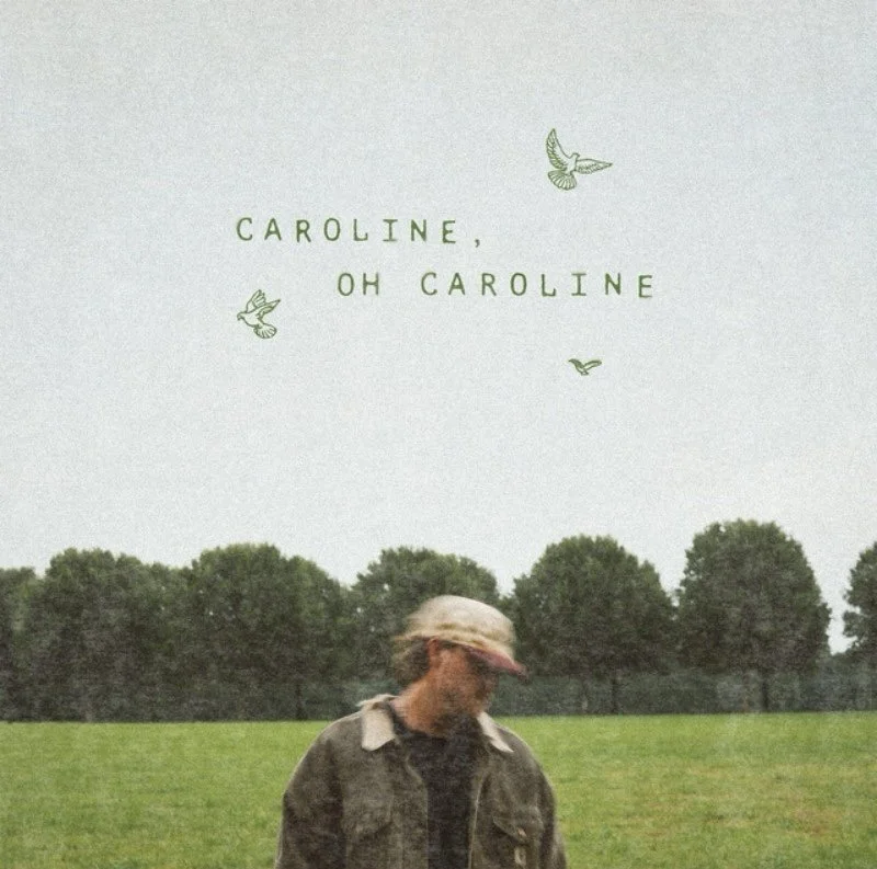 A person standing in a grassy field with a forest in the background, looking down, wearing a cap and jacket, with text above that reads 'Caroline, Oh Caroline' and three illustrations of flying birds.