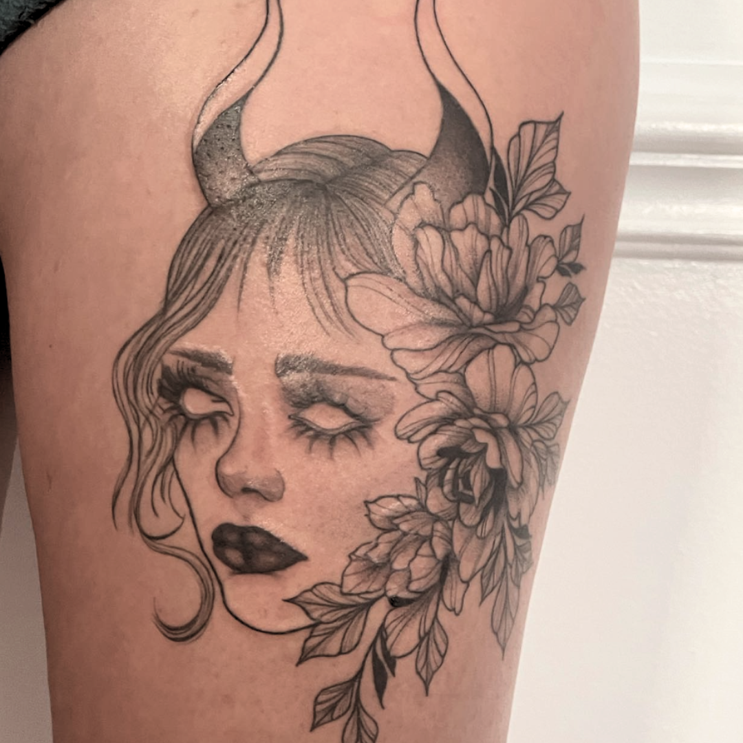Illustrative devil girl face tattoo with flowers by Yasmin in Durham, NC