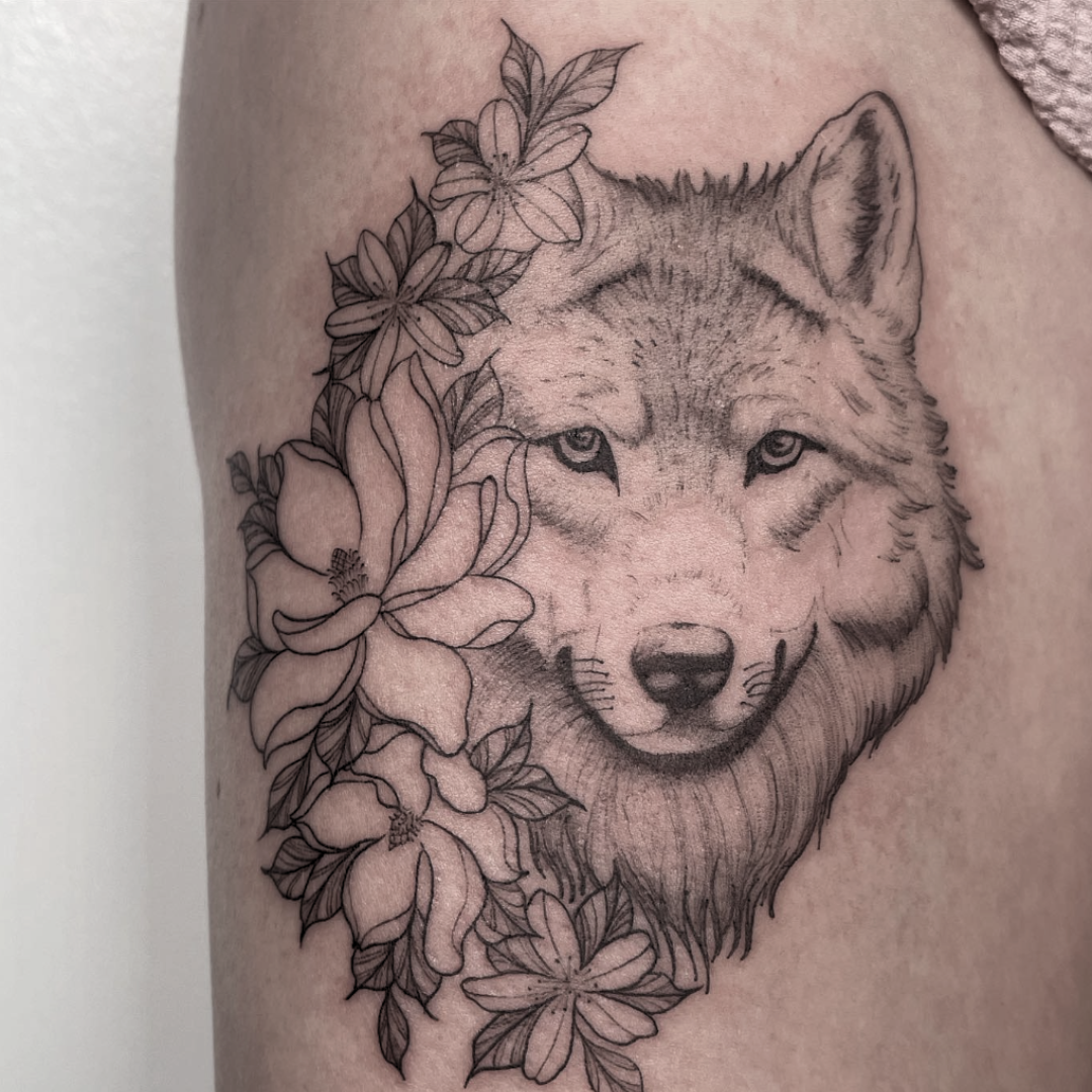 Illustrative wolf and floral tattoo by Yasmin at Ethereal Tattoo in Durham
