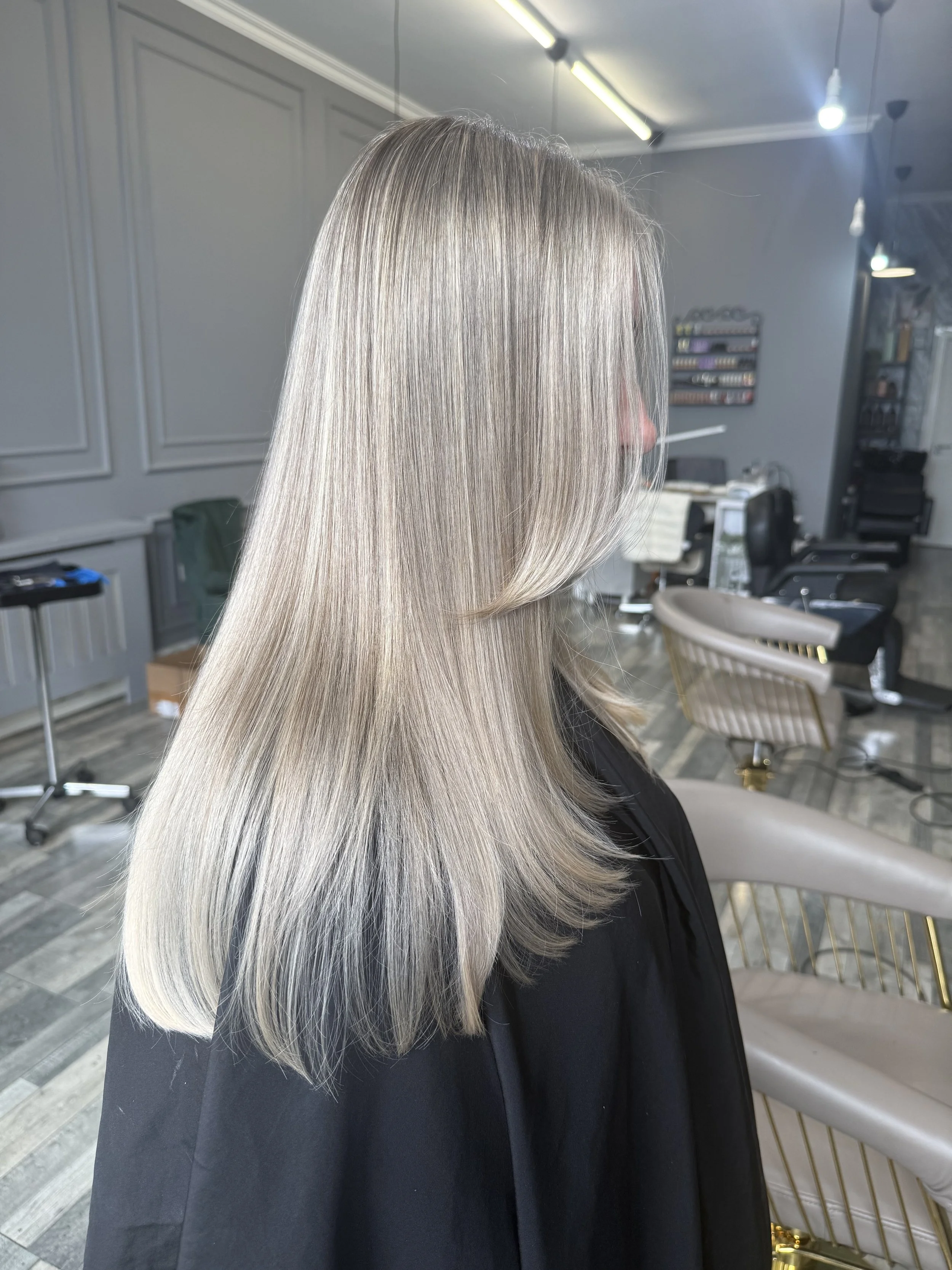 Silver blonde hair colour with a smothh layerd finish at CS London HairShine in Mill Hill, London