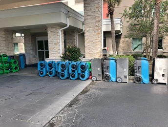 Image of water mold restoration equipment in front of hotel