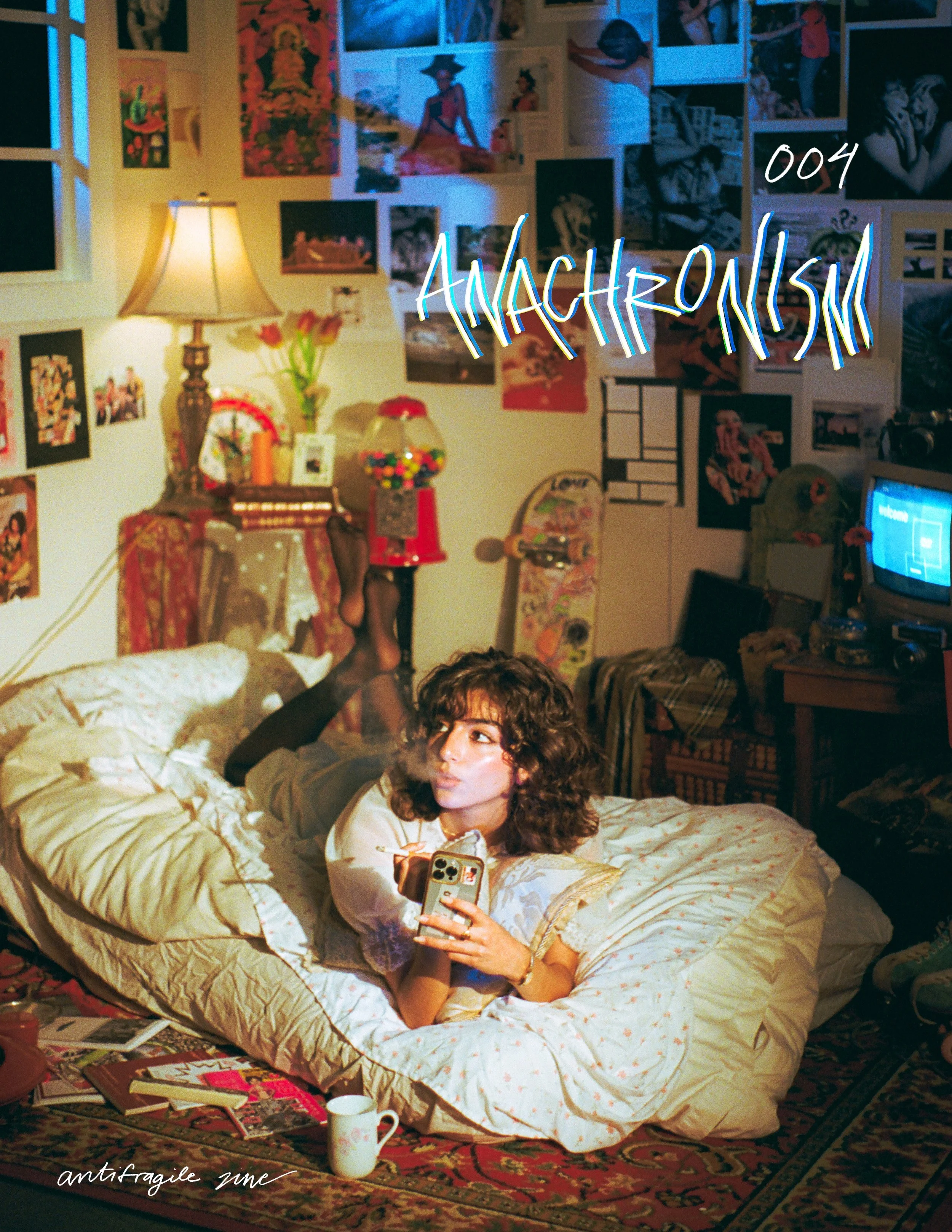 The cover of "antifragile zine" by Macey Keung, with title "004 Anachronism." It features a girl blowing smoke while laying on a mattress.