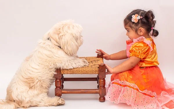 CHILD'S PORTRAIT WITH PET DOG