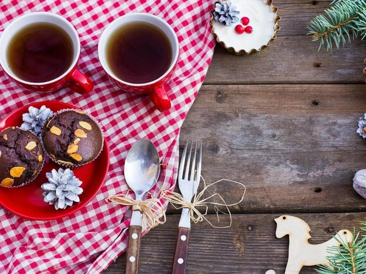 Tea and muffins on a holiday table representing mindful eating and balanced diet for managing bipolar disorder