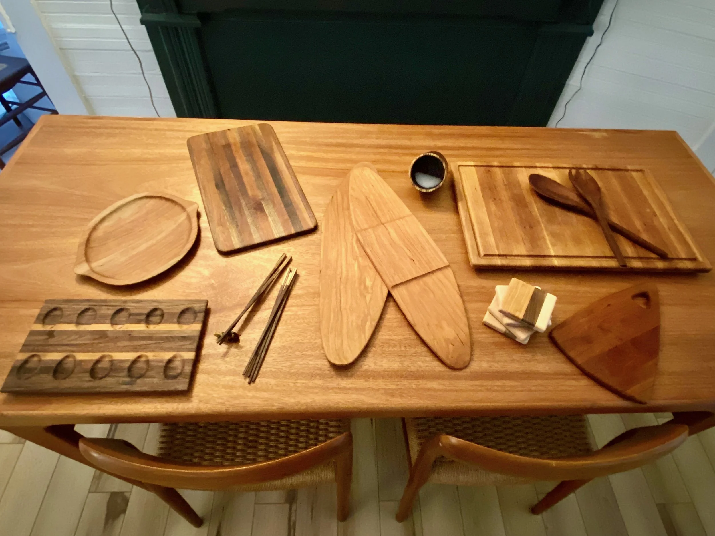 Assorted kitchen wares:  cutting boards, salt pig, salad tongs, deviled egg tray, serving platters, coasters, chopsticks