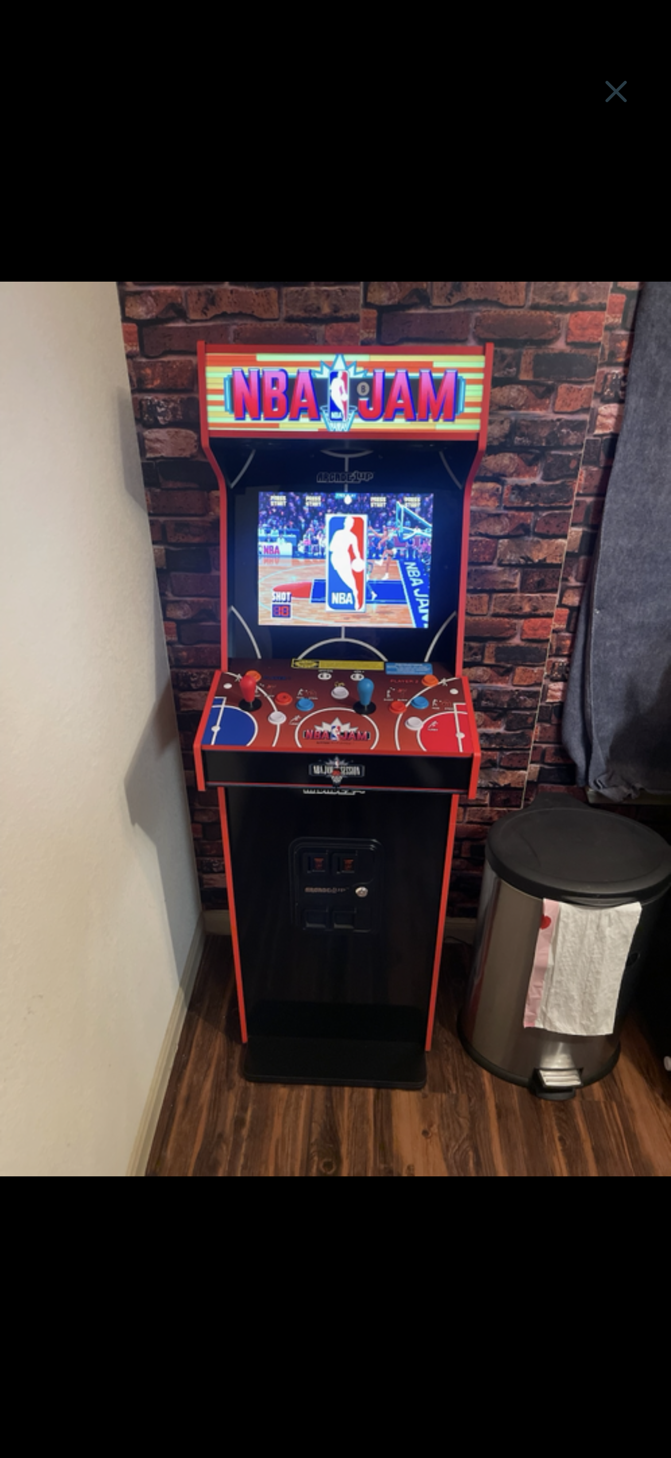 Arcade machine assembled and installed in home game room.