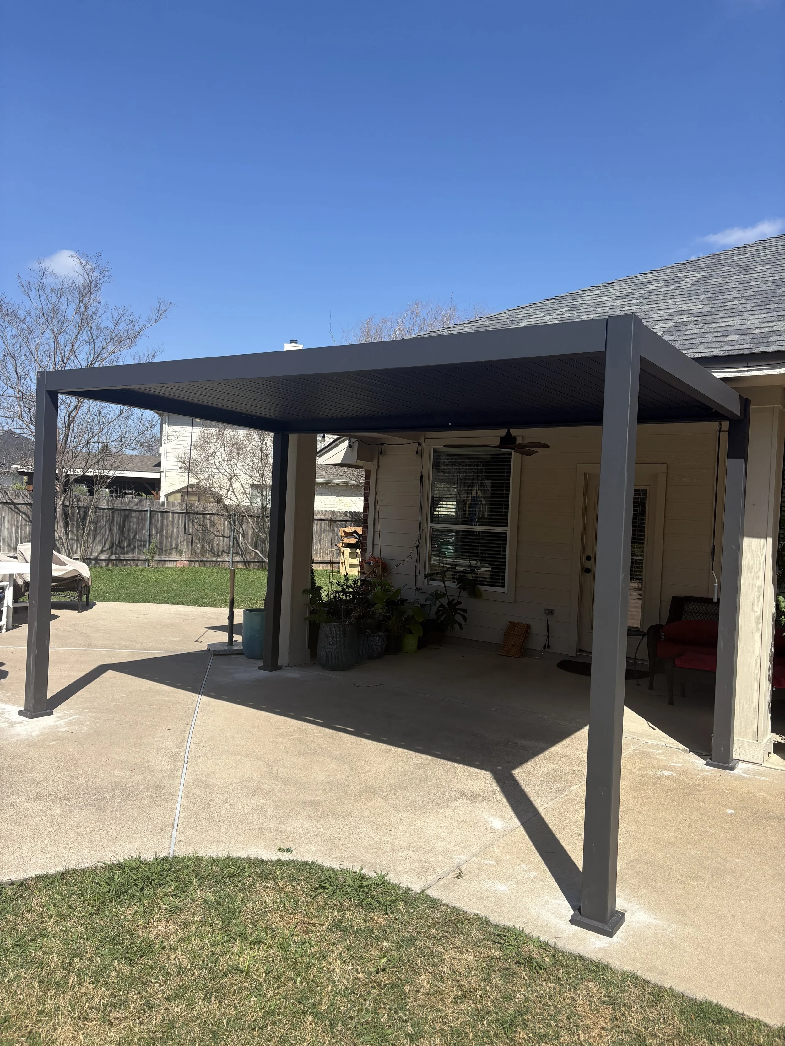 Outdoor pergola installed to create covered patio seating area.