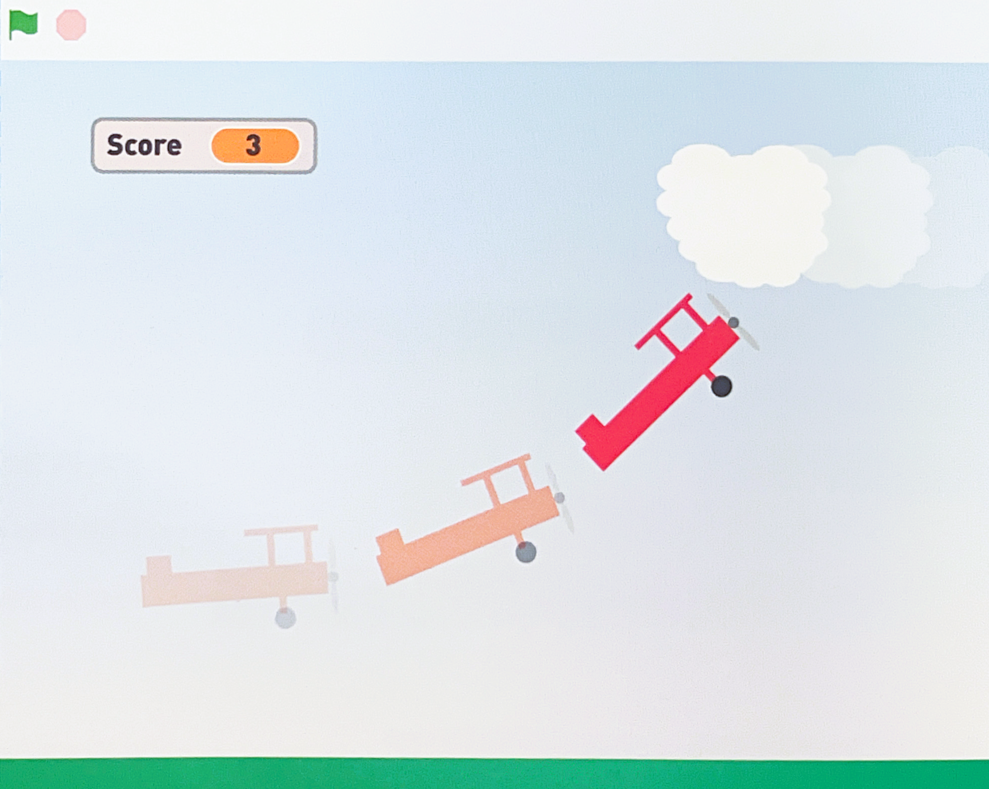 Screenshot of a simple airplane game with three cartoon biplanes flying upwards made with Scratch. A score of 3 is displayed.