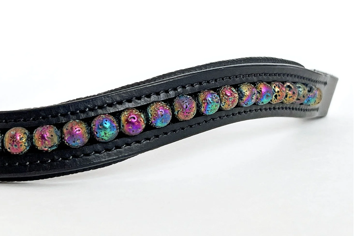 Close up of holographic rainbow lava beads in a black leather browband
