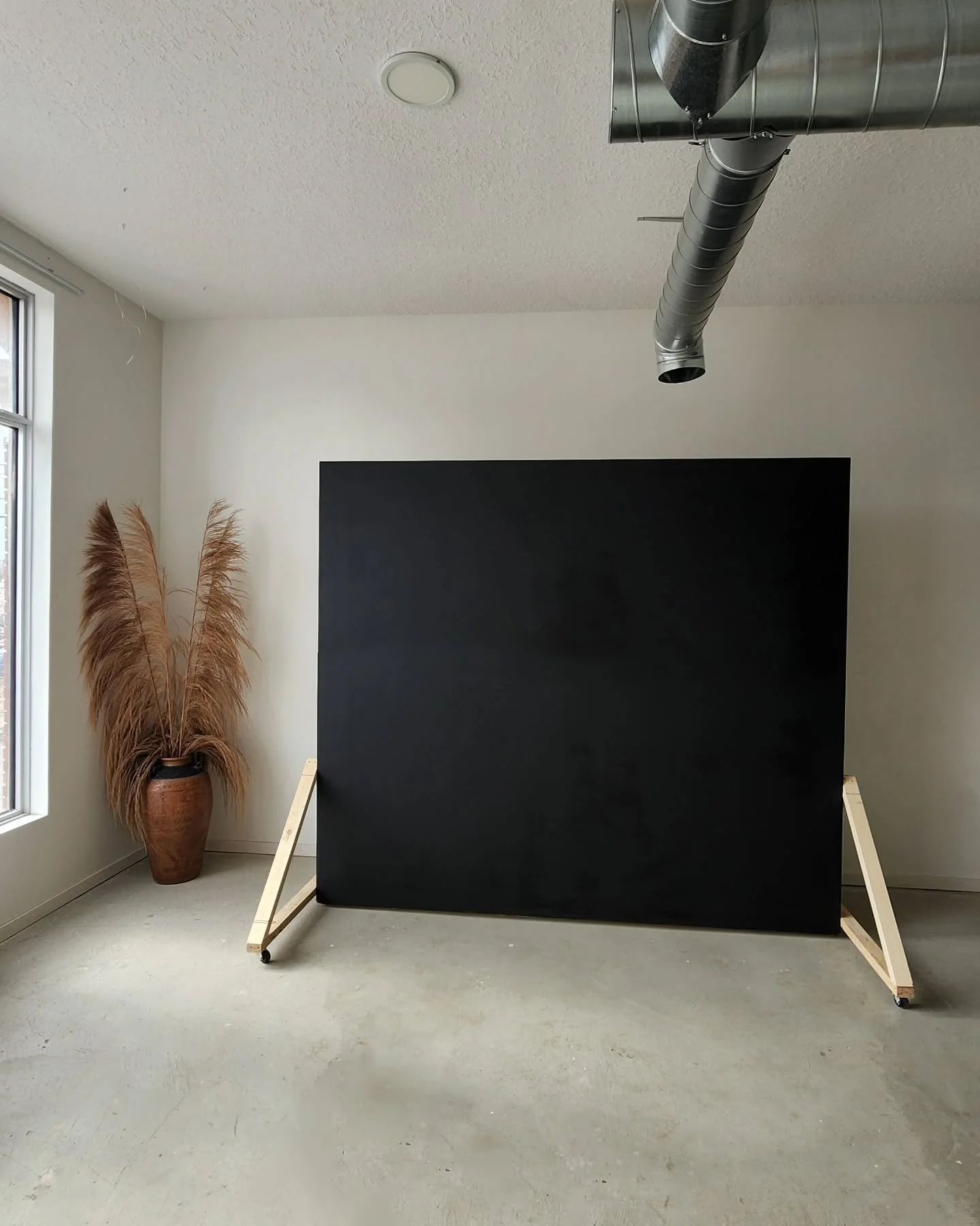 Our movable wall is finally ready to be used after sitting silently in the corner for the past little while! This 7ft tall, 8ft wide matte black beauty is ready to elevate your shoots. We&rsquo;ll be transforming the other side next&mdash;stay tuned!